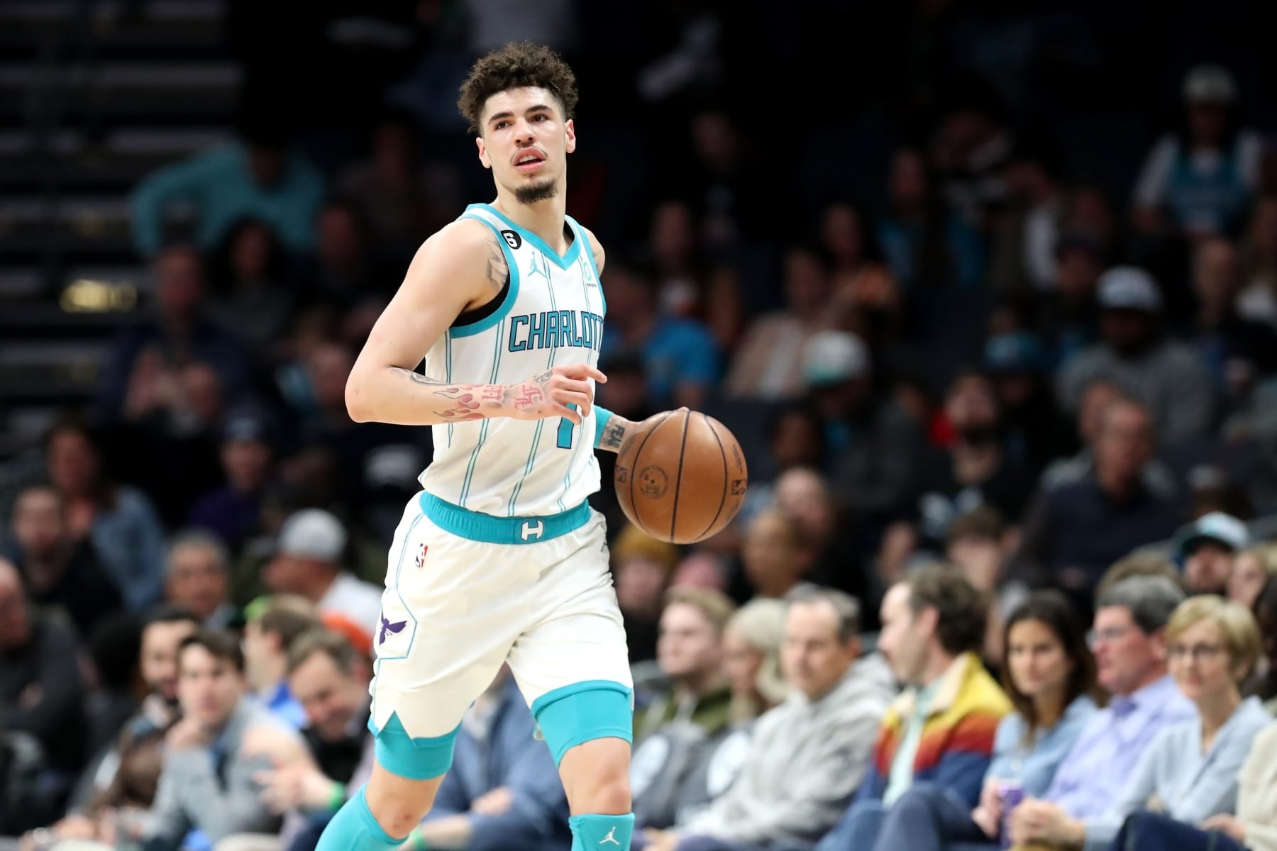 CHARLOTTE, NORTH CAROLINA - FEBRUARY 13: LaMelo Ball #1 of the Charlotte Hornets brings the ball down the court during the first period of a basketball game against the Atlanta Hawks at Spectrum Center on February 13, 2023 in Charlotte, North Carolina. NOTE TO USER: User expressly acknowledges and agrees that, by downloading and or using this photograph, User is consenting to the terms and conditions of the Getty Images License Agreement. (Photo by David Jensen/Getty Images)