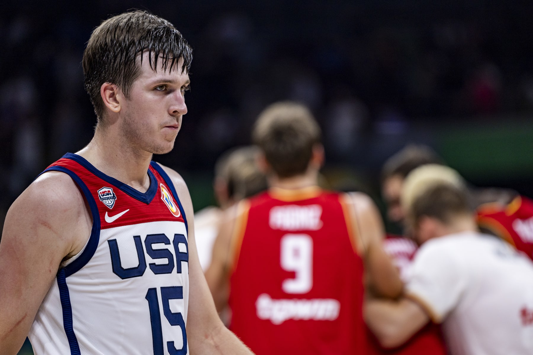 MANILA, PHILIPPINES - SEPTEMBER 08: Austin Reaves #15 of the United States leaves the court as Germany celebrates after winning the FIBA Basketball World Cup Semi Final game between USA and Germany at Mall of Asia Arena on September 08, 2023 in Manila, Philippines. (Photo by Ezra Acayan/Getty Images)