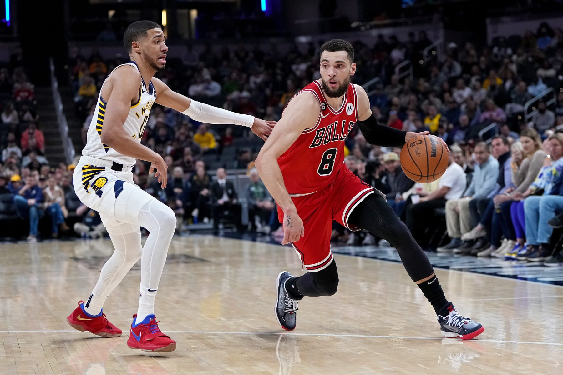 INDIANAPOLIS, INDIANA - FEBRUARY 15: Zach LaVine #8 of the Chicago Bulls dribbles the ball while being guarded by Tyrese Haliburton #0 of the Indiana Pacers in the first quarter at Gainbridge Fieldhouse on February 15, 2023 in Indianapolis, Indiana. NOTE TO USER: User expressly acknowledges and agrees that, by downloading and or using this photograph, User is consenting to the terms and conditions of the Getty Images License Agreement. (Photo by Dylan Buell/Getty Images)