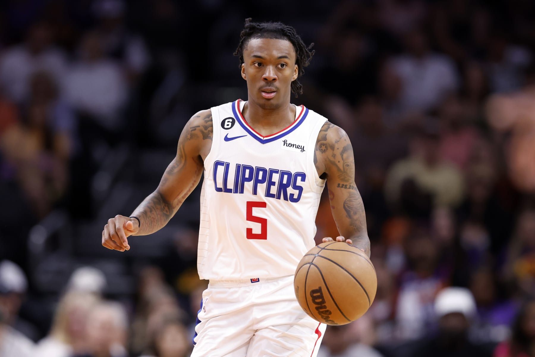 PHOENIX, ARIZONA - APRIL 09: Bones Hyland #5 of the Los Angeles Clippers dribbles the ball during the game against the Phoenix Suns at Footprint Center on April 09, 2023 in Phoenix, Arizona. The Clippers defeated the Suns 119-114. NOTE TO USER: User expressly acknowledges and agrees that, by downloading and or using this photograph, User is consenting to the terms and conditions of the Getty Images License Agreement.  (Photo by Chris Coduto/Getty Images)