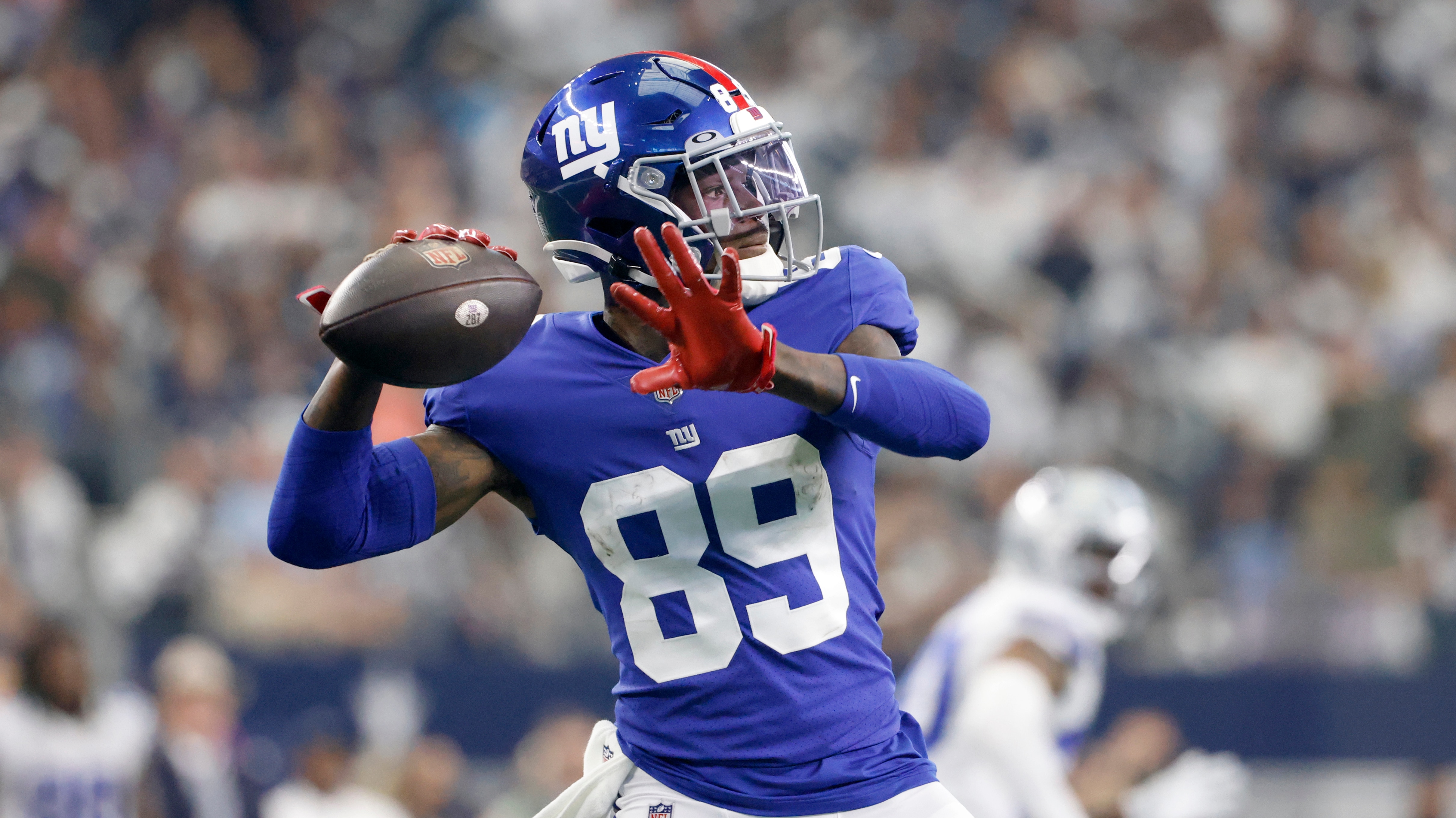 New York Giants wide receiver Kadarius Toney (89) throws a pass against the Dallas Cowboys in an NFL football game in Arlington, Texas, Sunday, Oct. 10, 2021. (AP Photo/Ron Jenkins)