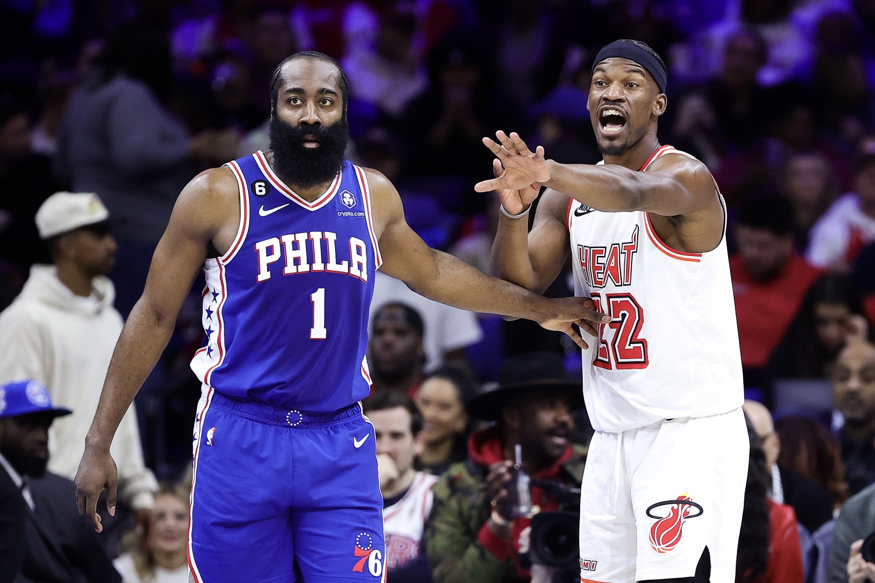 PHILADELPHIA, PENNSYLVANIA - FEBRUARY 27: James Harden #1 of the Philadelphia 76ers and Jimmy Butler #22 of the Miami Heat react during the second quarter at Wells Fargo Center on February 27, 2023 in Philadelphia, Pennsylvania. NOTE TO USER: User expressly acknowledges and agrees that, by downloading and or using this photograph, User is consenting to the terms and conditions of the Getty Images License Agreement. (Photo by Tim Nwachukwu/Getty Images)