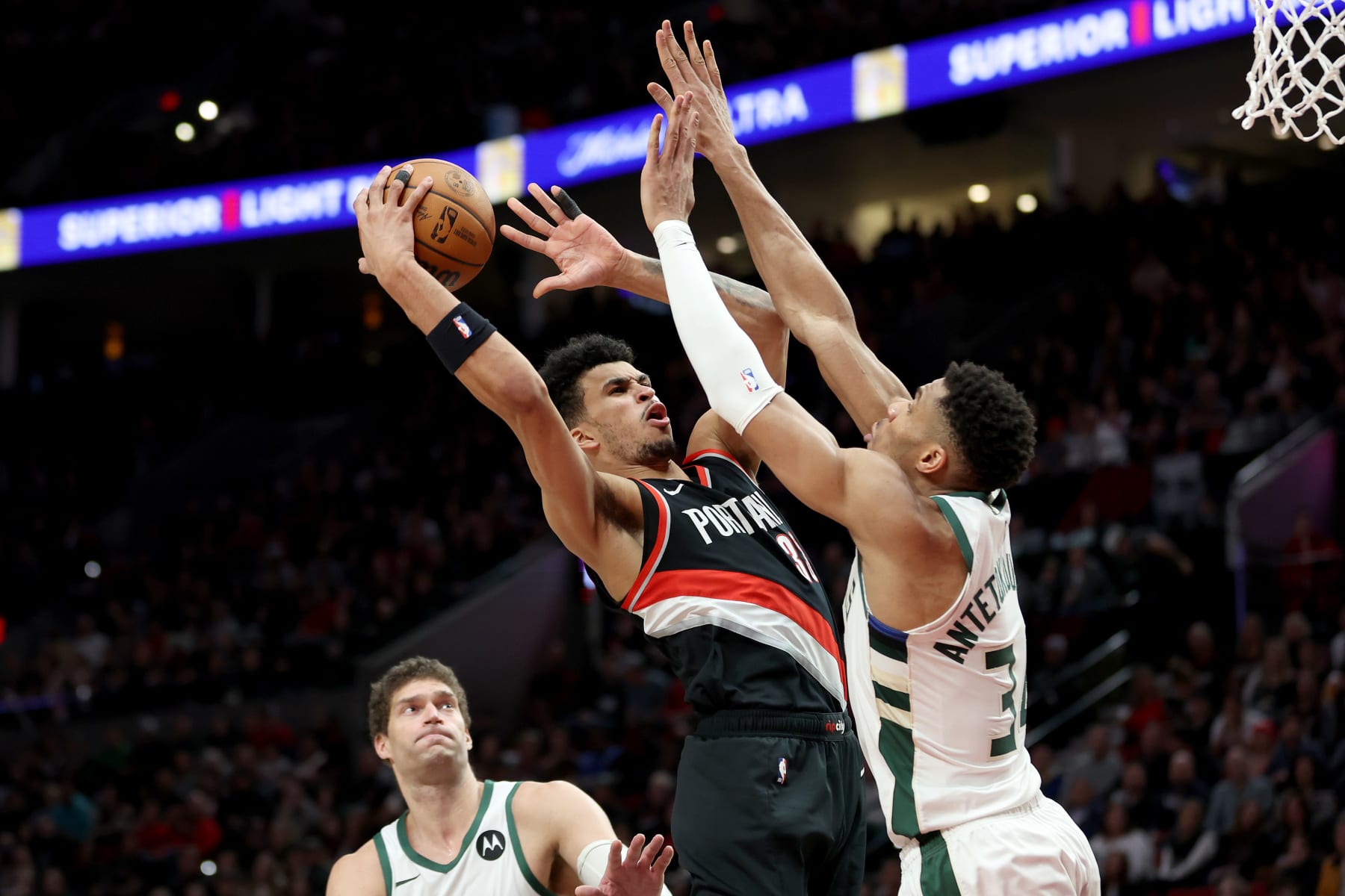 PORTLAND, OREGON - JANUARY 31: Toumani Camara #33 of the Portland Trail Blazers shoots against Giannis Antetokounmpo #34 of the Milwaukee Bucks during the fourth quarter at Moda Center on January 31, 2024 in Portland, Oregon. (Photo by Steph Chambers/Getty Images)