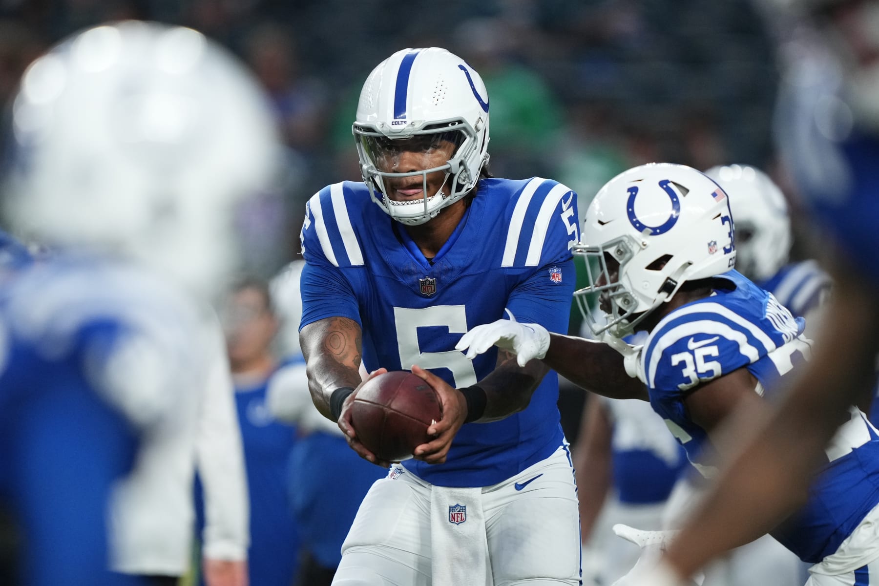 Indianapolis Colts quarterback Anthony Richardson (5) warms up with teammates before an NFL preseason football game against the Philadelphia Eagles on Thursday, Aug. 24, 2023, in Philadelphia. (AP Photo/Matt Rourke)