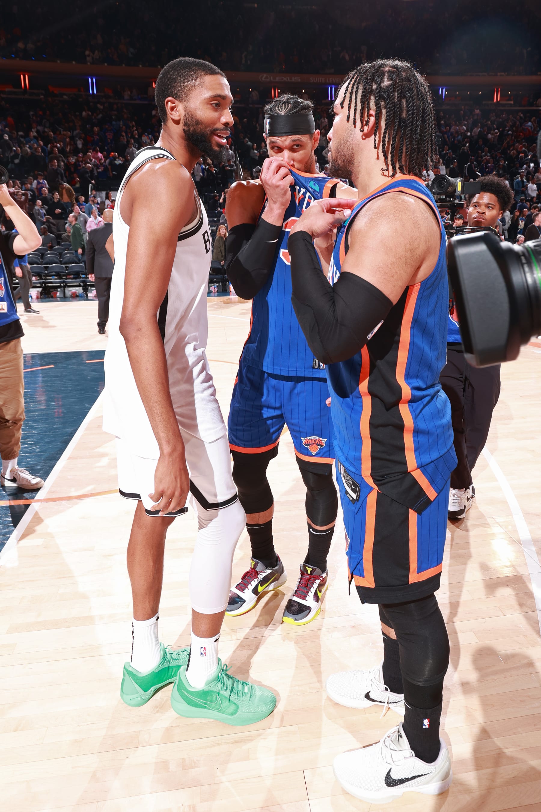 NEW YORK, NY - MARCH 23: Jalen Brunson #11 and Josh Hart #3 of the New York Knicks talk to Mikal Bridges #1 of the Brooklyn Nets after the game on March 23, 2024 at Madison Square Garden in New York City, New York.  NOTE TO USER: User expressly acknowledges and agrees that, by downloading and or using this photograph, User is consenting to the terms and conditions of the Getty Images License Agreement. Mandatory Copyright Notice: Copyright 2024 NBAE  (Photo by Nathaniel S. Butler/NBAE via Getty Images)