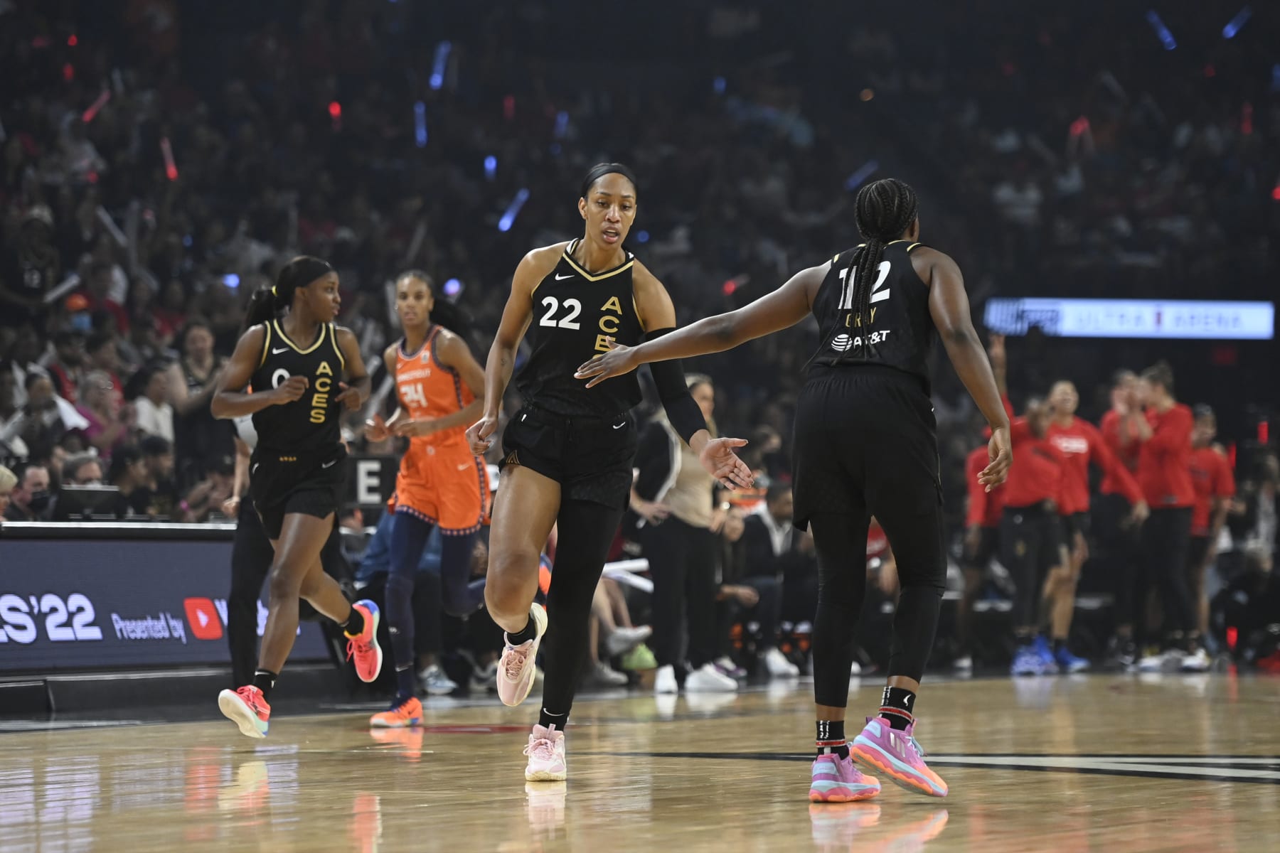 LAS VEGAS, NV - SEPTEMBER 11: A'ja Wilson #22 of the Las Vegas Aces high fives Chelsea Gray #12 of the Las Vegas Aces during Game 1 of the 2022 WNBA Finals on September 11, 2022 at  Michelob ULTRA Arena in Las Vegas, Nevada. NOTE TO USER: User expressly acknowledges and agrees that, by downloading and or using this photograph, User is consenting to the terms and conditions of the Getty Images License Agreement. Mandatory Copyright Notice: Copyright 2022 NBAE (Photo by David Becker/NBAE via Getty Images)