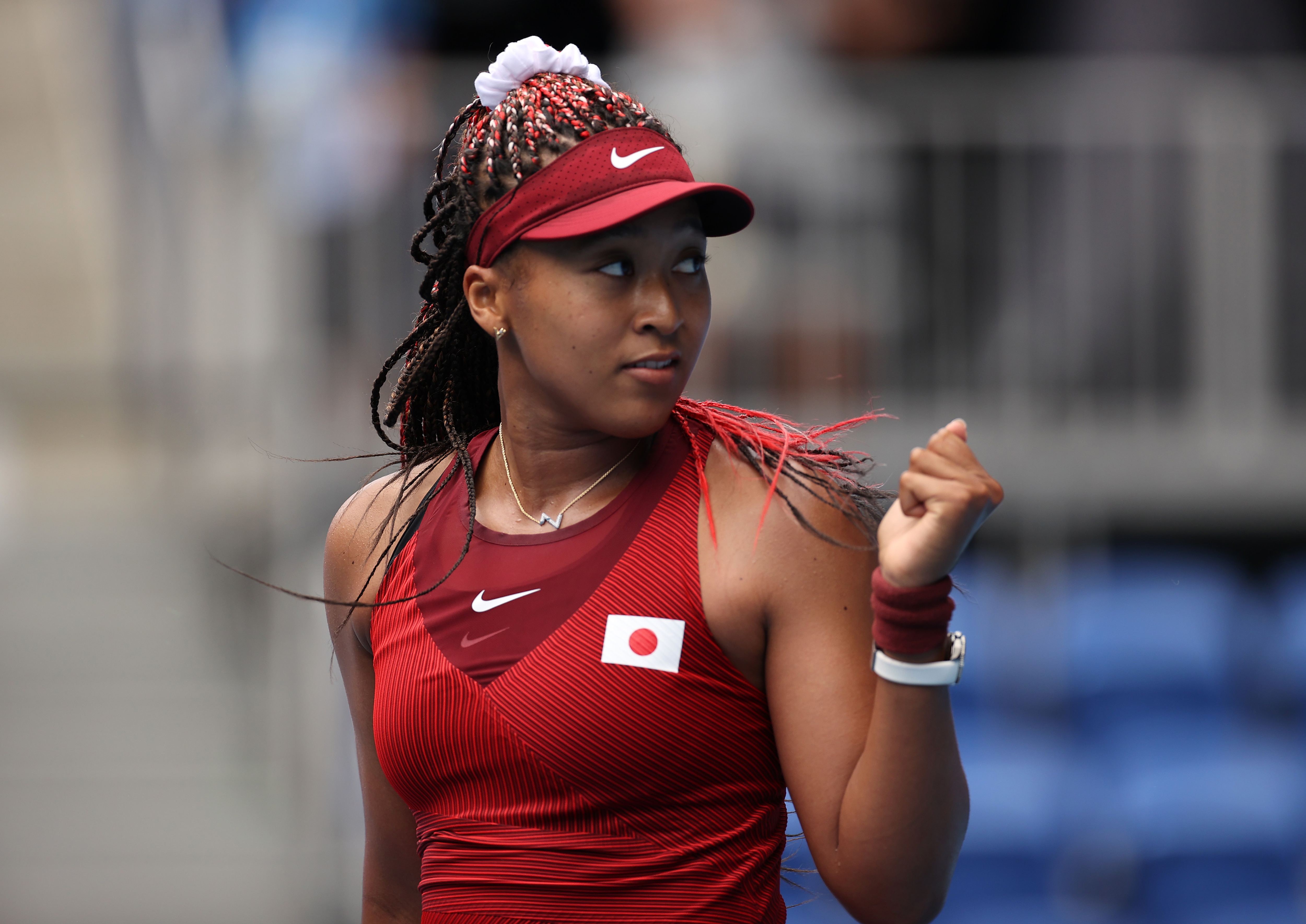 TOKYO, JAPAN - JULY 26: Naomi Osaka of Team Japan celebrates after match point in her Women's Singles Second Round match against Viktorija Golubic of Team Switzerland on day three of the Tokyo 2020 Olympic Games at Ariake Tennis Park on July 26, 2021 in Tokyo, Japan. (Photo by Clive Brunskill/Getty Images)