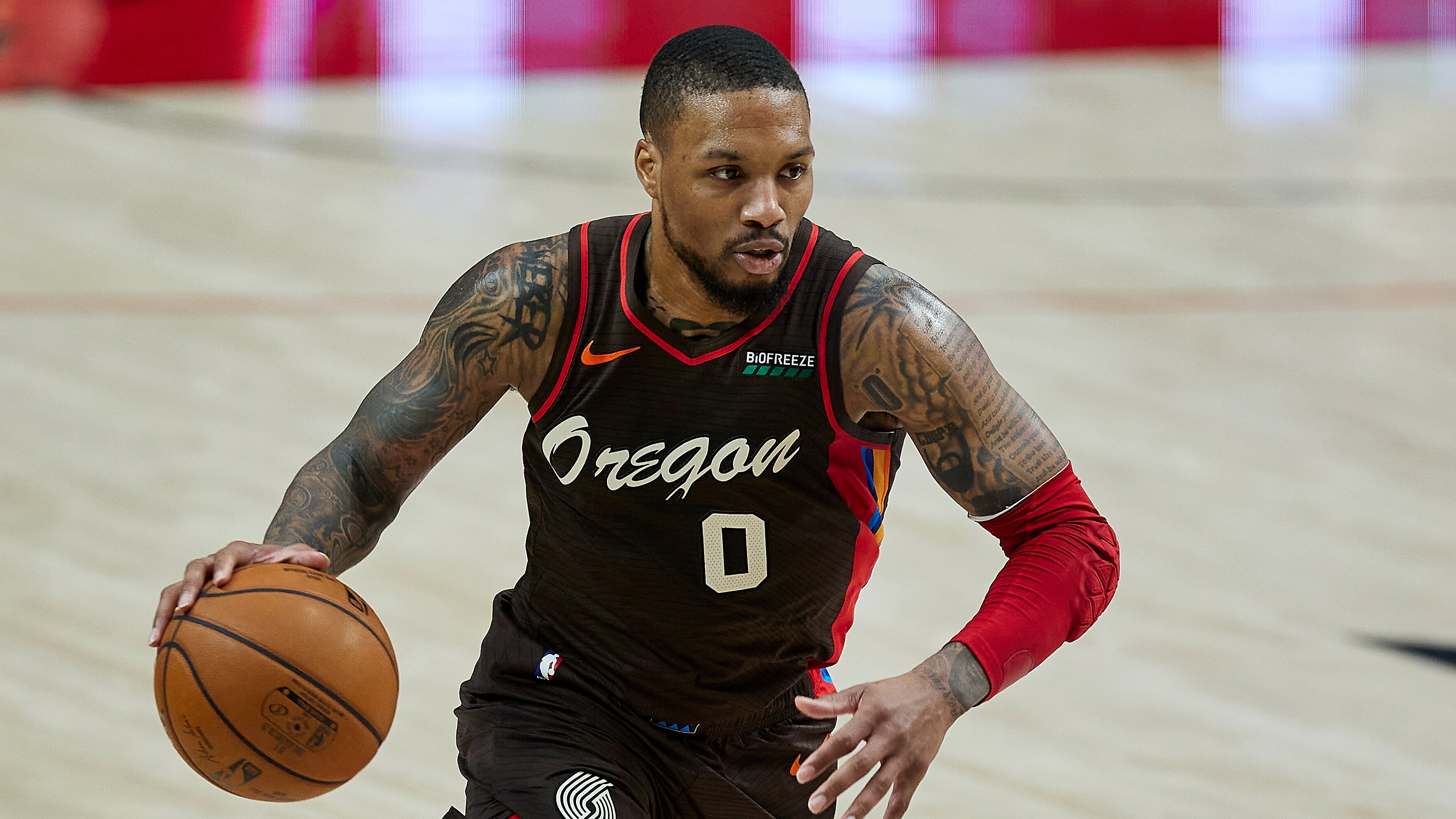 Portland Trail Blazers guard Damian Lillard brings the ball up court against the Golden State Warriors during the first half of an NBA basketball game in Portland, Ore., Wednesday, March 3, 2021. (AP Photo/Craig Mitchelldyer)
