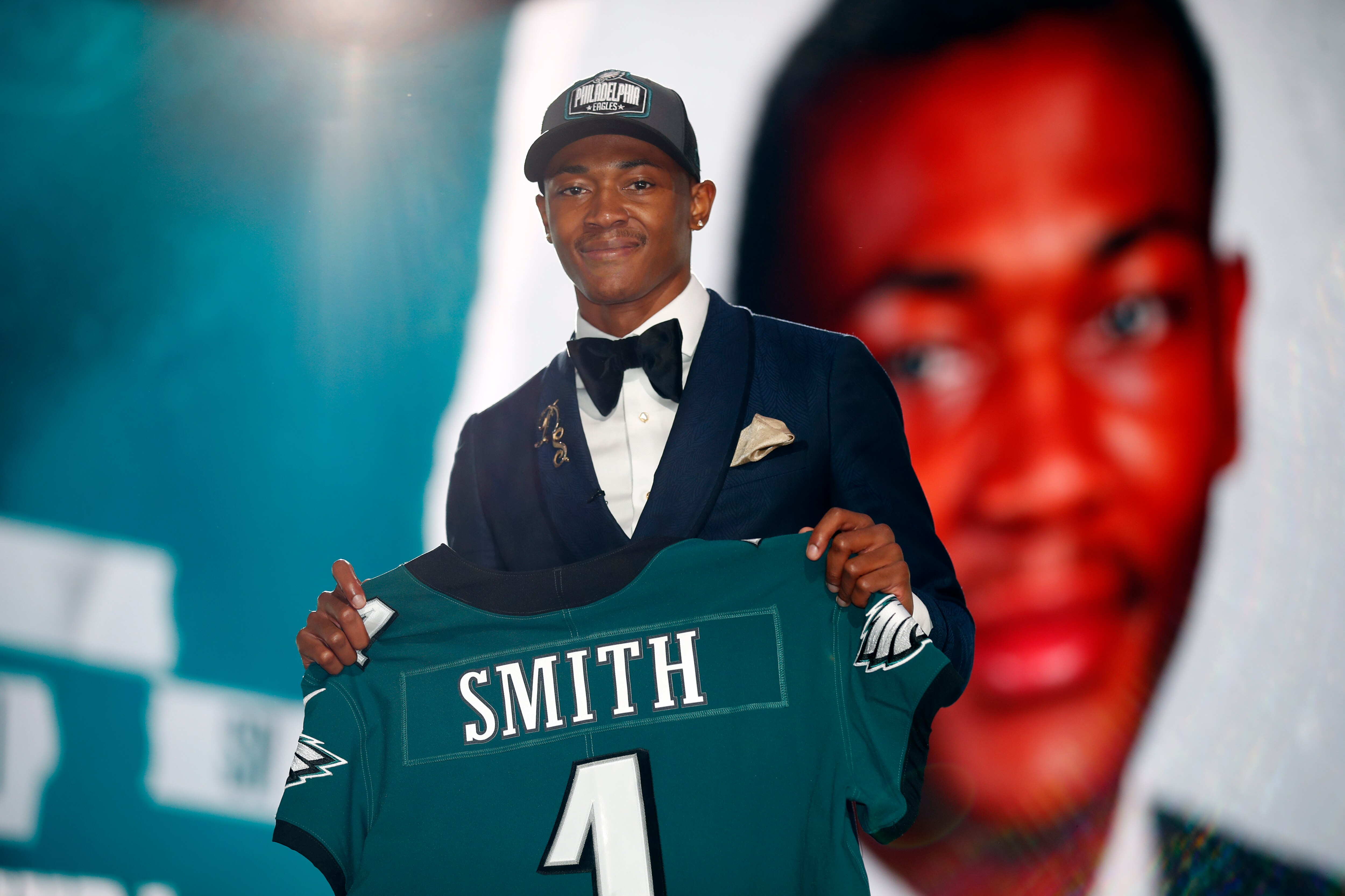 Alabama wide receiver DeVonta Smith holds a team jersey after he was chosen by the Philadelphia Eagles with the 10th pick in the first round of the NFL football draft Thursday April 29, 2021, in Cleveland. (Jeff Haynes/AP Images for Panini)