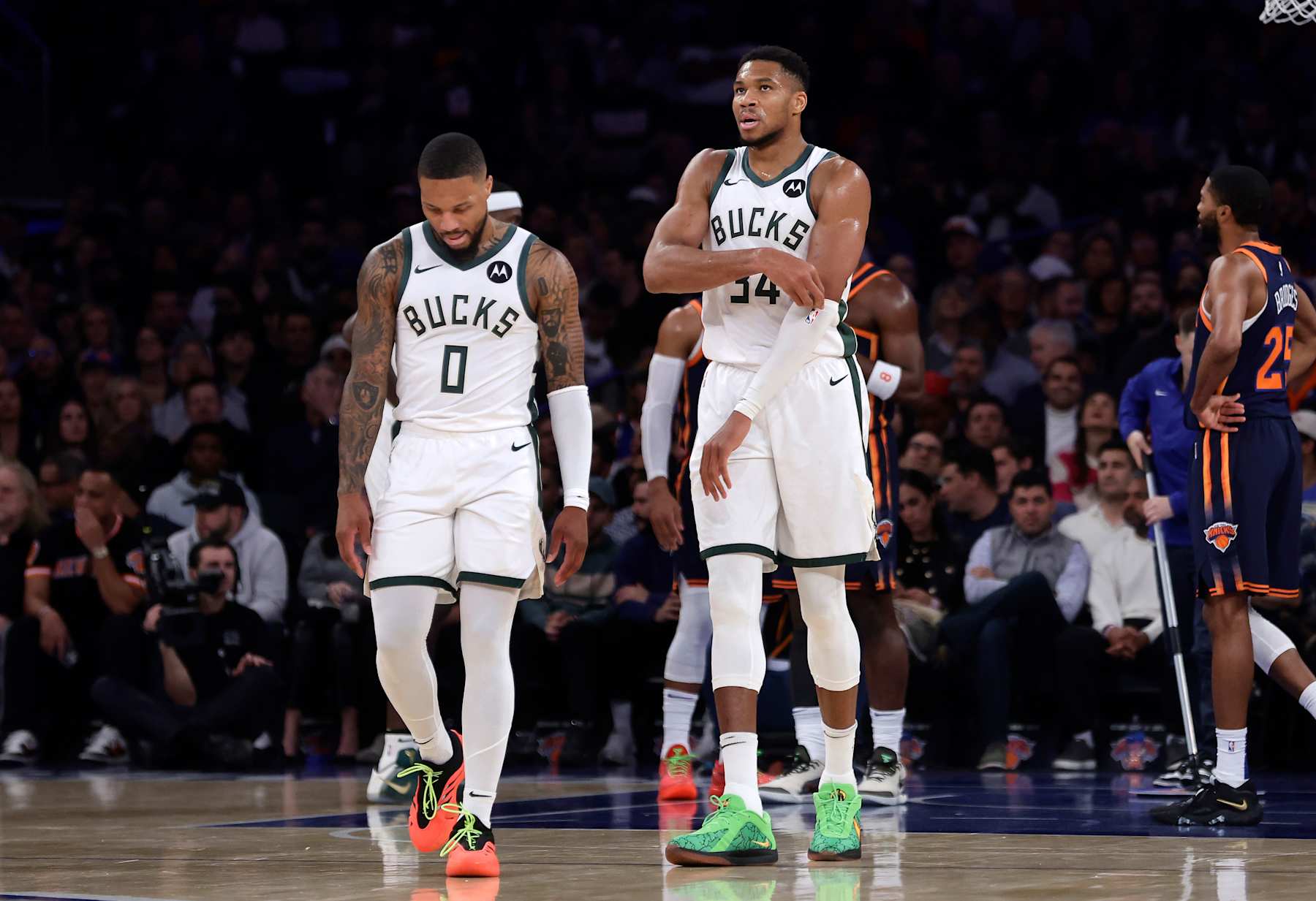 NEW YORK, NEW YORK - NOVEMBER 08: (NEW YORK DAILIES OUT)  Giannis Antetokounmpo #34 and Damian Lillard #0 of the Milwaukee Bucks in action against the New York Knicks at Madison Square Garden on November 08, 2024 in New York City. The Knicks defeated the Bucks 116-94. NOTE TO USER: User expressly acknowledges and agrees that, by downloading and or using this photograph, User is consenting to the terms and conditions of the Getty Images License Agreement. (Photo by Jim McIsaac/Getty Images)