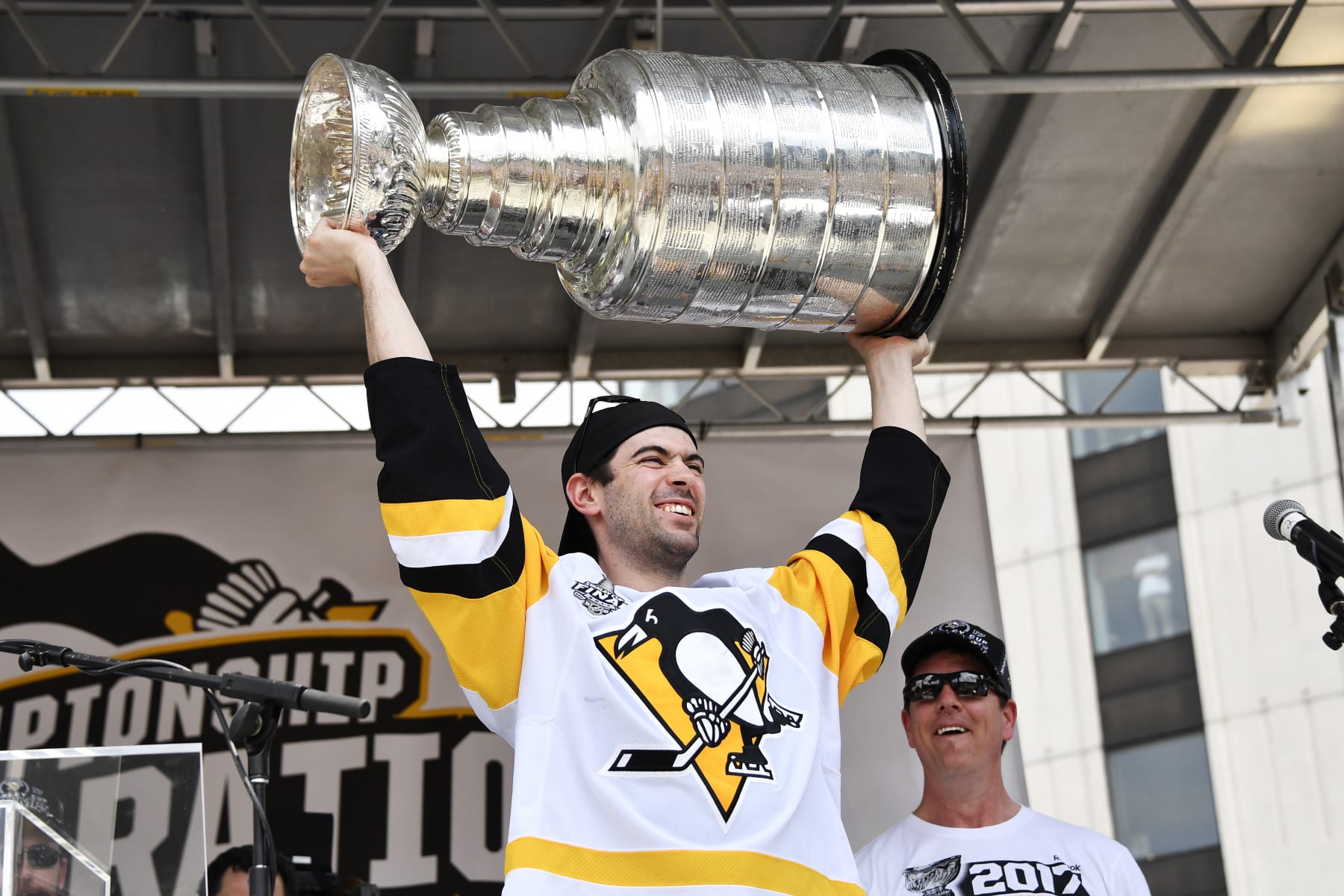 PITTSBURGH, PA - JUNE 14: Pittsburgh Penguins defenseman Justin Schultz (4) hoists the Stanley Cup in celebration during the 2017 Pittsburgh Penguins Stanley Cup Champion Victory Parade on June 14, 2017 in Pittsburgh, PA. (Photo by Jeanine Leech/Icon Sportswire via Getty Images)