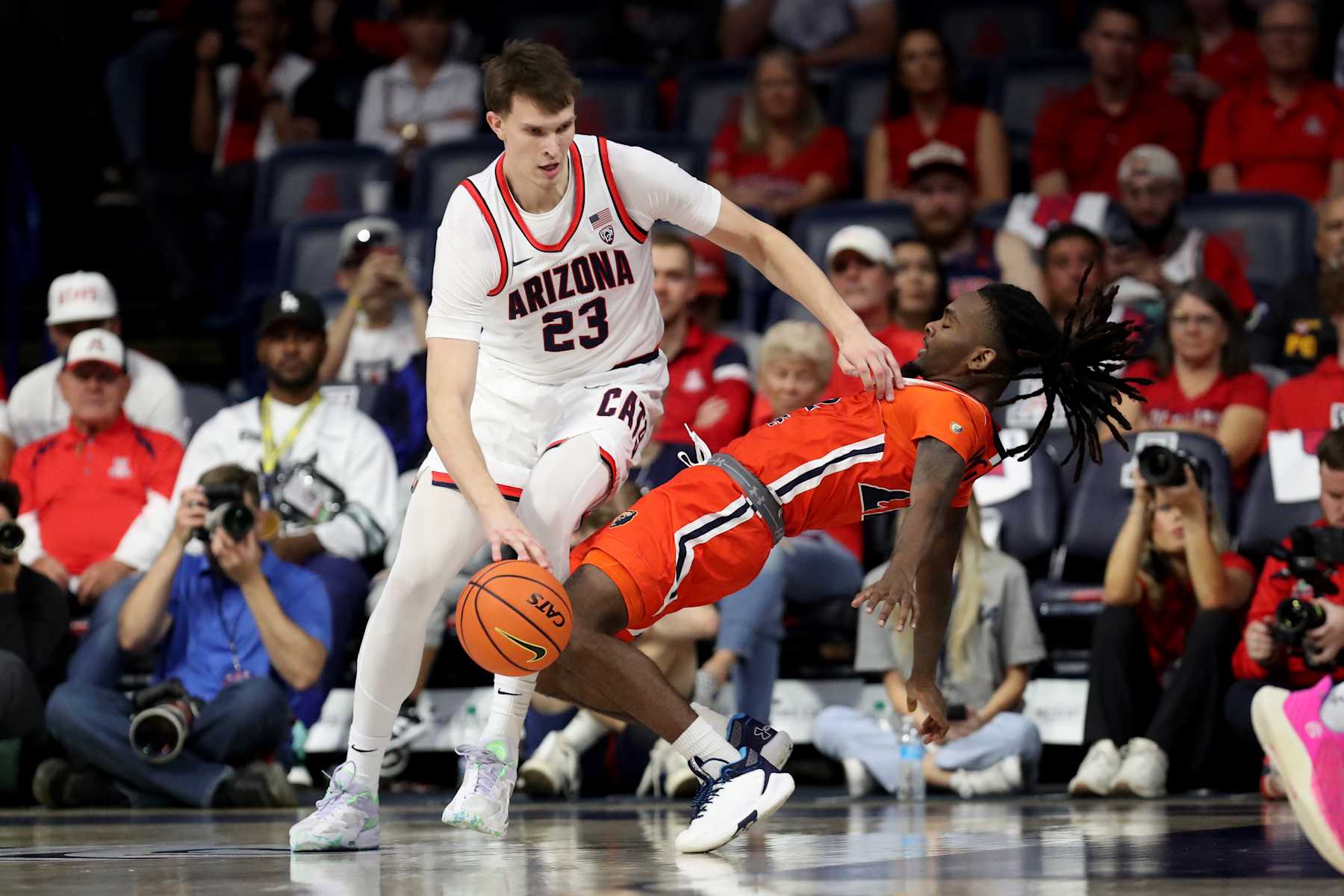 TUCSON, AZ - NOVEMBER 06: Arizona Wildcats forward Paulius Murauskas #23 drives into Morgan State Bears guard Kevon Wiggins #22 during the second half of a basketball game between the Morgan State Bears and the University of Arizona Wildcats on November 6, 2023 at McKale Center in Tucson, AZ. (Photo by Christopher Hook/Icon Sportswire via Getty Images)