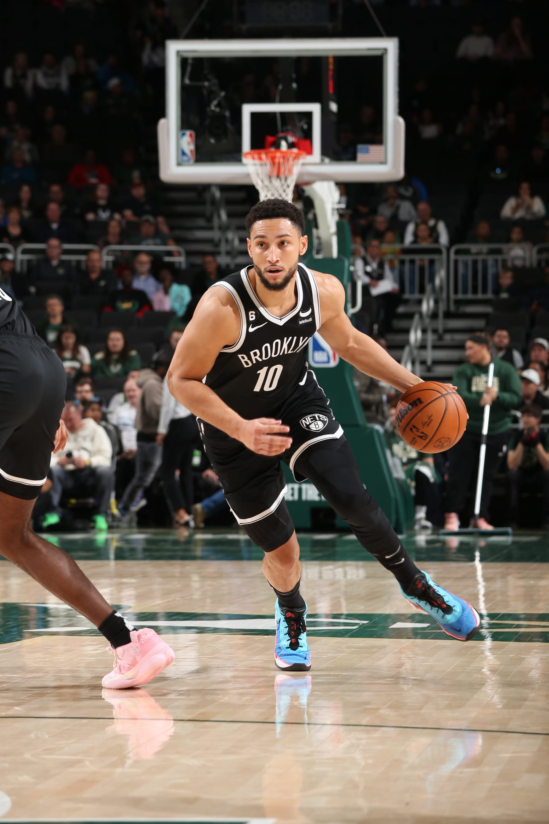 MILWAUKEE, WI - OCTOBER 12: Ben Simmons #10 of the Brooklyn Nets drives to the basket during the game against the Milwaukee Bucks on October 12, 2022 at the Fiserv Forum Center in Milwaukee, Wisconsin. NOTE TO USER: User expressly acknowledges and agrees that, by downloading and or using this Photograph, user is consenting to the terms and conditions of the Getty Images License Agreement. Mandatory Copyright Notice: Copyright 2022 NBAE (Photo by Gary Dineen/NBAE via Getty Images).