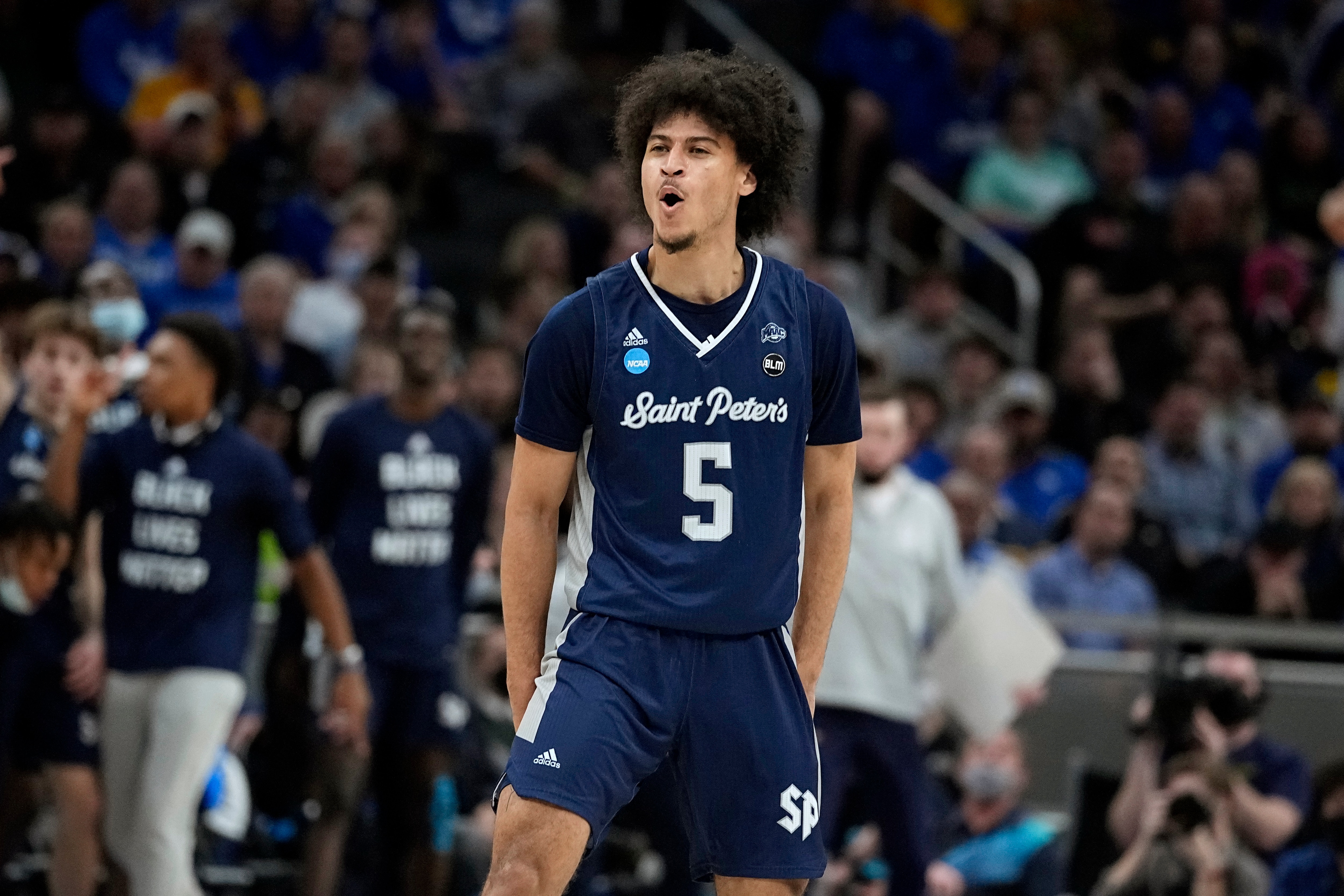 St. Peter's guard Daryl Banks III (5) celebrates after making a 3-point basket during the first half of a college basketball game against Kentucky in the first round of the NCAA tournament, Thursday, March 17, 2022, in Indianapolis. (AP Photo/Darron Cummings)