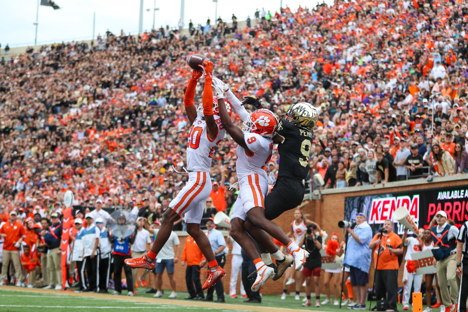 WINSTON-SALEM, NC - SEPTEMBER 24: Nate Wiggins (20) and R.J. Mickens (9) of the Clemson Tigers breaks up a pass to A.T. Perry (9) of the Wake Forest Demon Deacons during a football game between the Wake Forest Demon Deacons and the Clemson Tigers on September 24, 2022, at Truist Field in Winston-Salem, NC. (Photo by David Jensen/Icon Sportswire via Getty Images)
