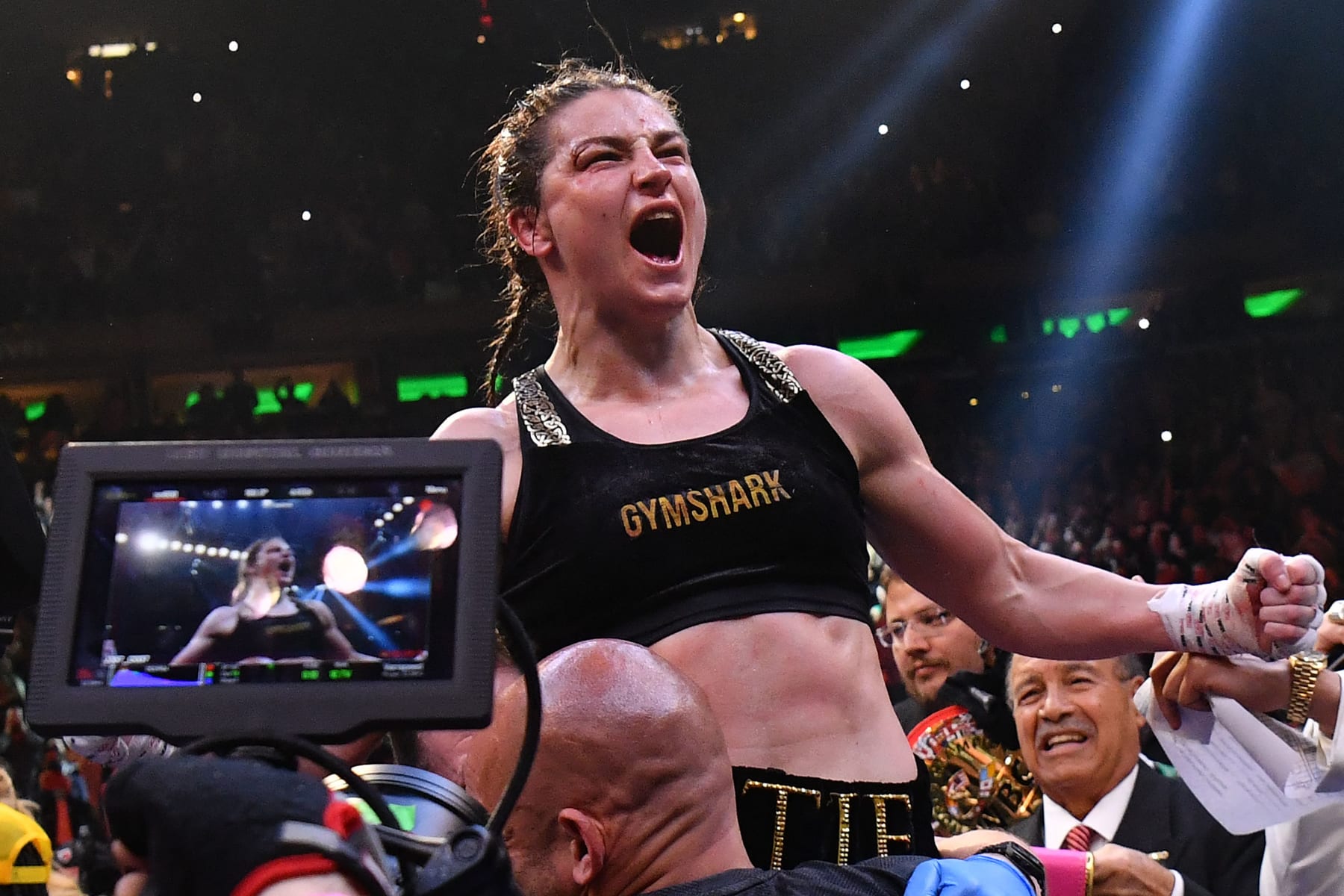 Irish boxer Katie Taylor (C) celebrates after defeating Puerto Rican boxer Amanda Serrano for the World Lightweight Title fight at Madison Square Garden on April 30, 2022 in New York City. (Photo by Angela Weiss / AFP) (Photo by ANGELA WEISS/AFP via Getty Images)