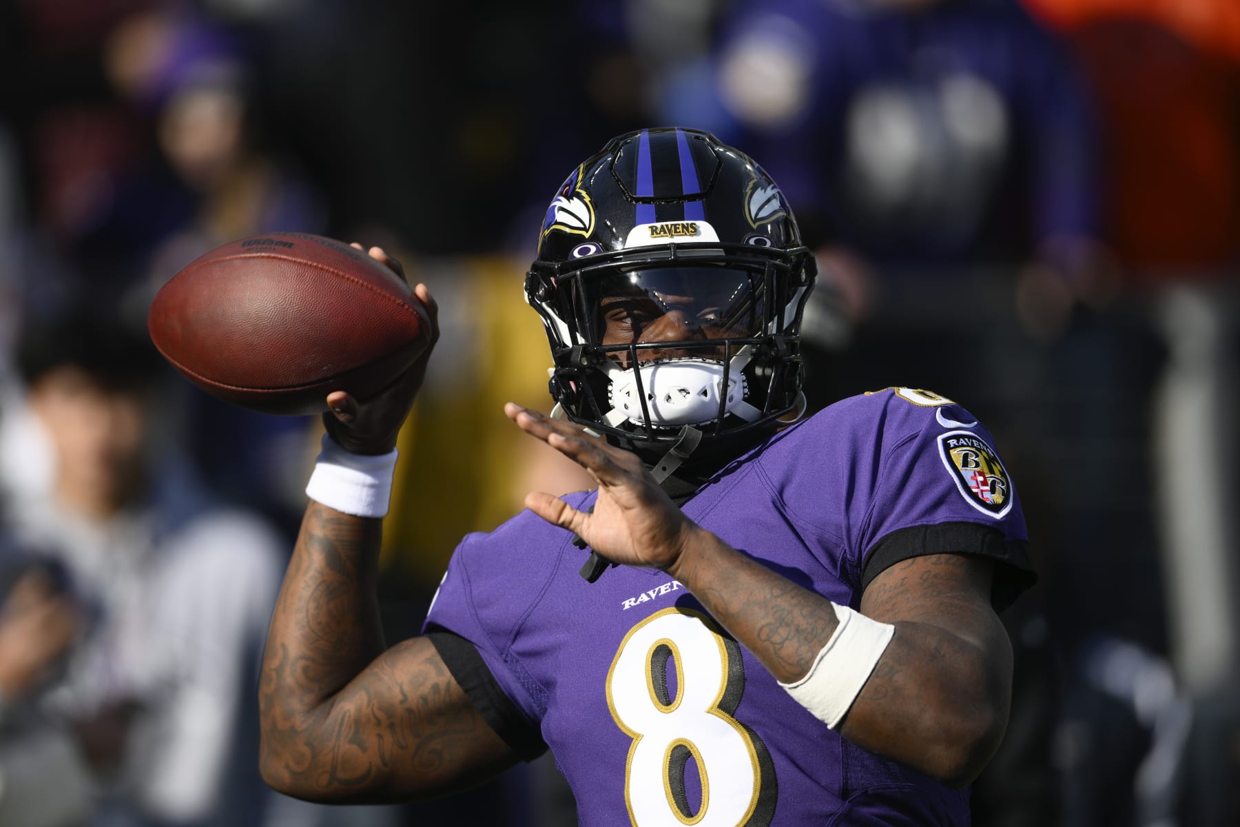 Baltimore Ravens quarterback Lamar Jackson (8) looks to pass during warm-ups ahead of an NFL football game against the Denver Broncos, Sunday, Dec. 4, 2022, in Baltimore. (AP Photo/Nick Wass)