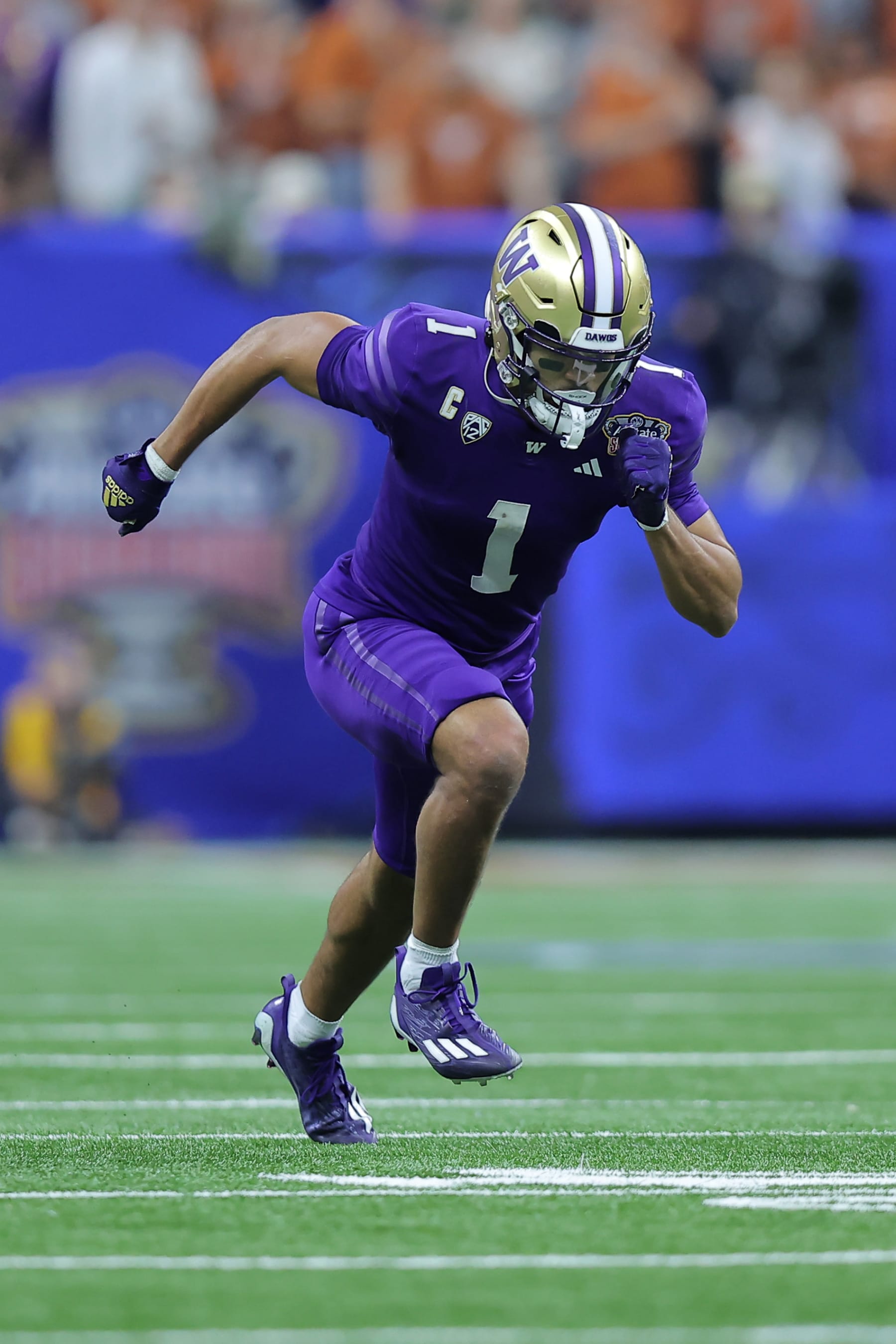 NEW ORLEANS, LOUISIANA - JANUARY 01: Rome Odunze #1 of the Washington Huskies in action against the Texas Longhorns during the CFP Semifinal Allstate Sugar Bowl at Caesars Superdome on January 01, 2024 in New Orleans, Louisiana. (Photo by Jonathan Bachman/Getty Images)