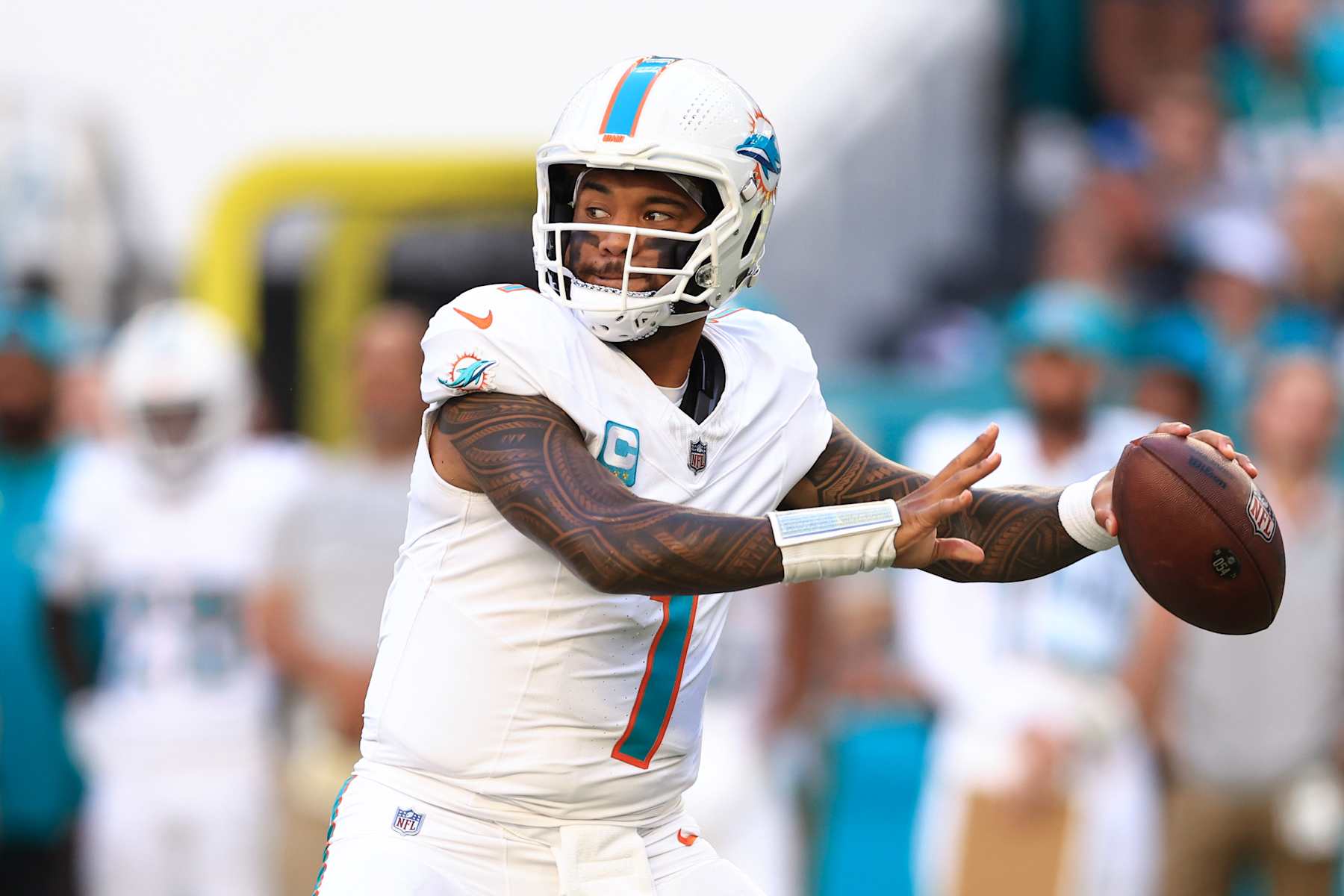 MIAMI GARDENS, FLORIDA - DECEMBER 08: Tua Tagovailoa #1 of the Miami Dolphins throws a pass against the New York Jets during the second half of the game at Hard Rock Stadium on December 08, 2024 in Miami Gardens, Florida. (Photo by Megan Briggs/Getty Images)