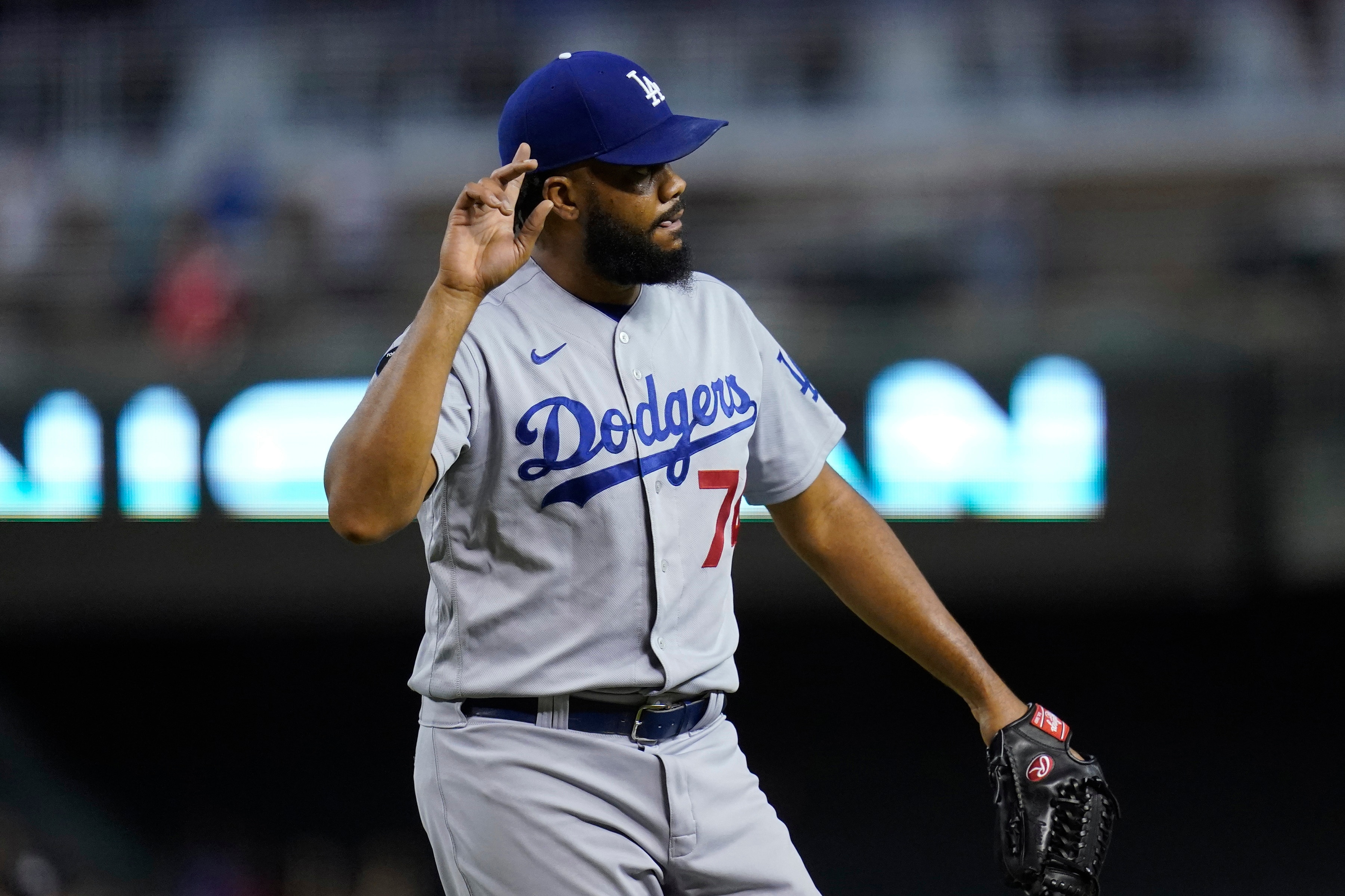 Los Angeles Dodgers relief pitcher Kenley Jansen celebrates the team's 3-0 win over the Arizona Diamondbacks in a baseball game Friday, June 18, 2021, in Phoenix. (AP Photo/Ross D. Franklin)