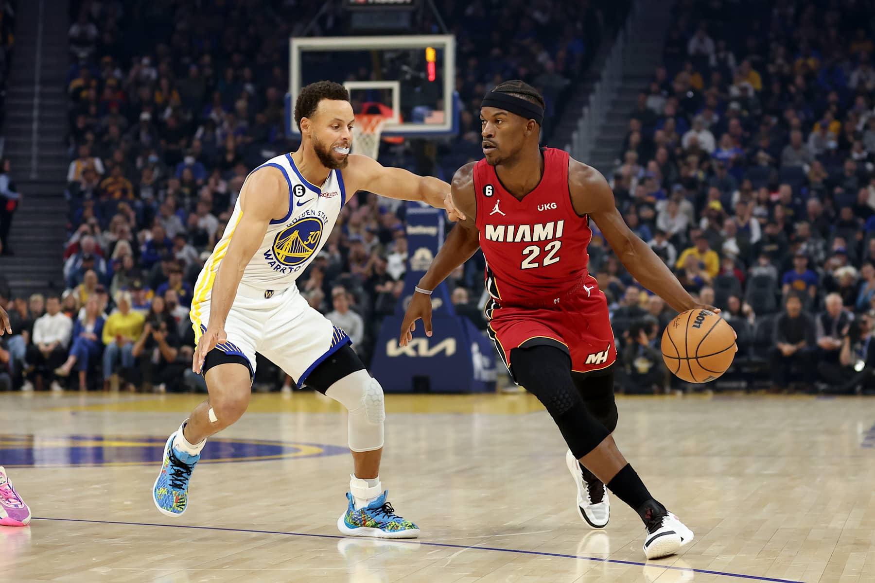 SAN FRANCISCO, CALIFORNIA - OCTOBER 27: Jimmy Butler #22 of the Miami Heat is guarded by Stephen Curry #30 of the Golden State Warriors at Chase Center on October 27, 2022 in San Francisco, California. NOTE TO USER: User expressly acknowledges and agrees that, by downloading and or using this photograph, User is consenting to the terms and conditions of the Getty Images License Agreement.  (Photo by Ezra Shaw/Getty Images)