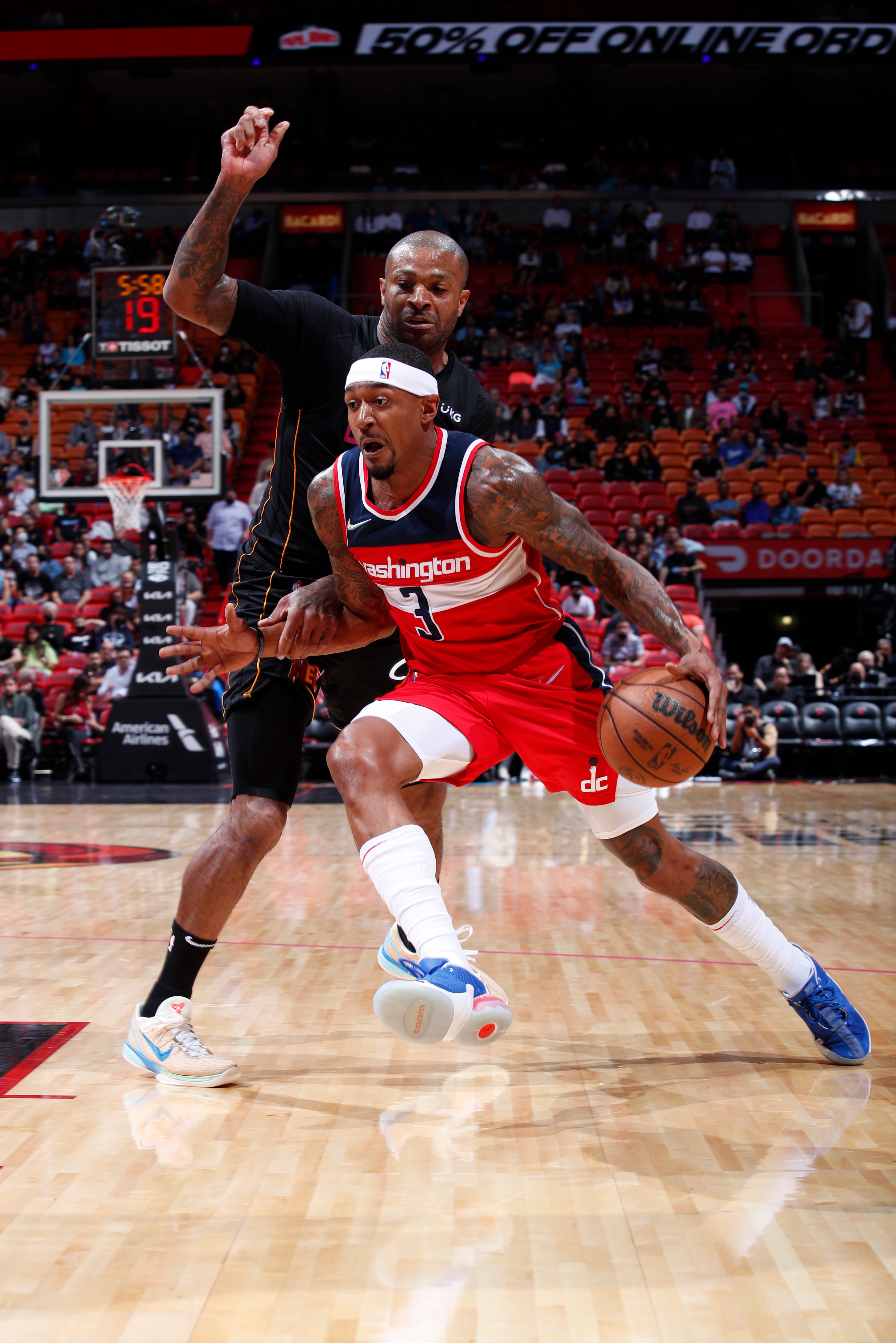 MIAMI, FL - NOVEMBER 18: Bradley Beal #3 of the Washington Wizards drives to the basket during the game against the Miami Heat on November 18, 2021 at FTX Arena in Miami, Florida. NOTE TO USER: User expressly acknowledges and agrees that, by downloading and or using this Photograph, user is consenting to the terms and conditions of the Getty Images License Agreement. Mandatory Copyright Notice: Copyright 2021 NBAE (Photo by Jeff Haynes/NBAE via Getty Images)