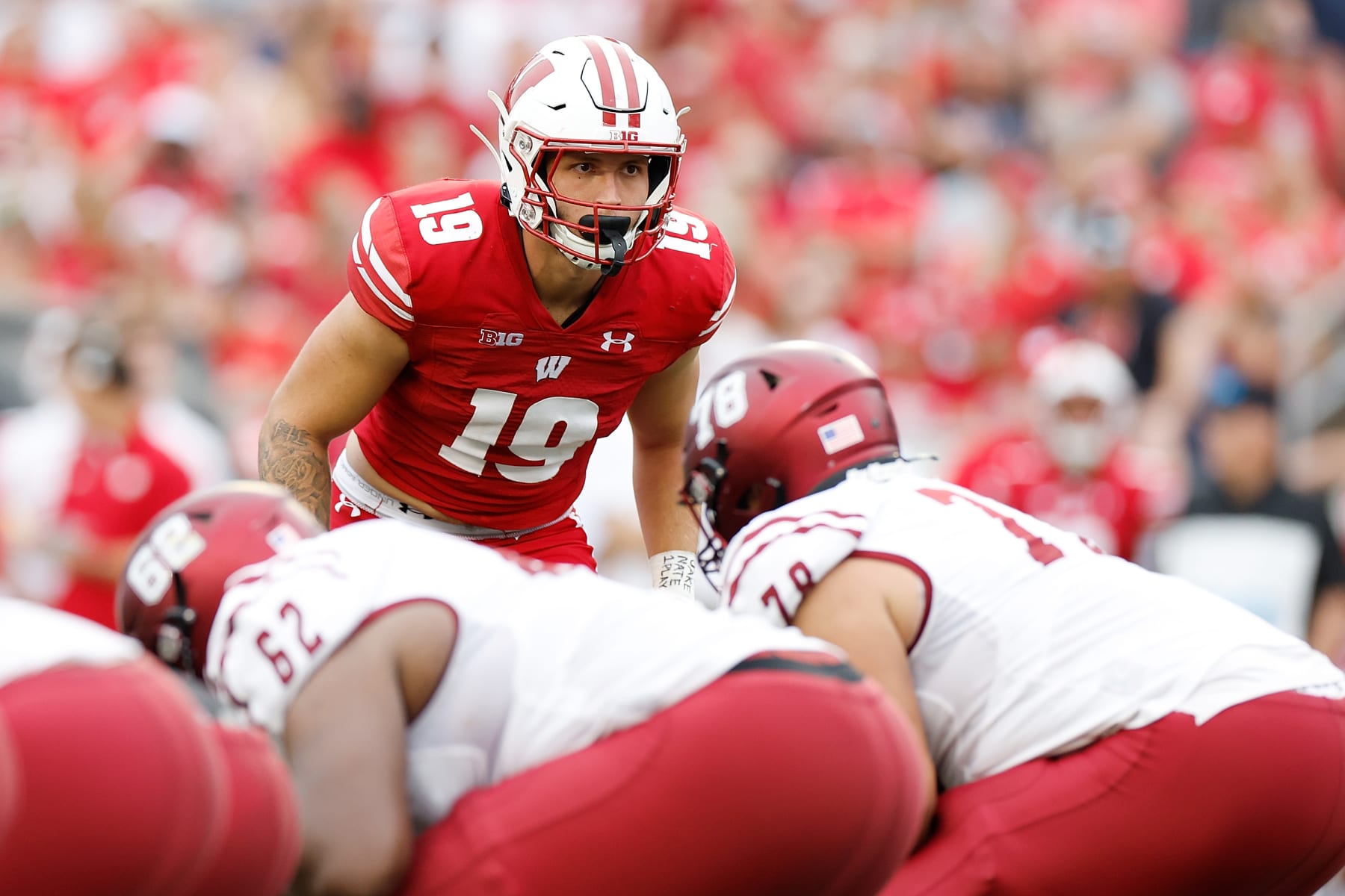 MADISON, WISCONSIN - SEPTEMBER 17: Nick Herbig #19 of the Wisconsin Badgers before the snap against the New Mexico State Aggies at Camp Randall Stadium on September 17, 2022 in Madison, Wisconsin. (Photo by John Fisher/Getty Images)