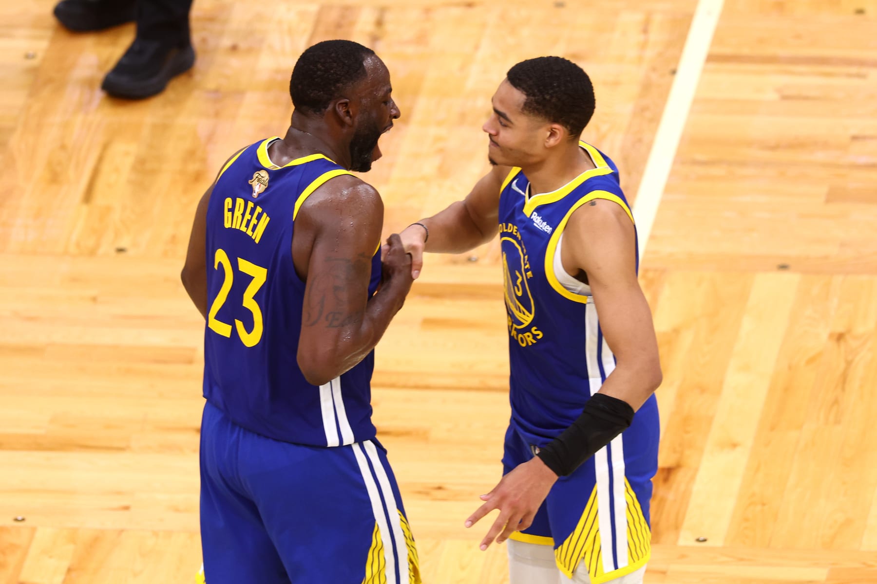 BOSTON, MASSACHUSETTS - JUNE 16: Jordan Poole #3 and Draymond Green #23 of the Golden State Warriors celebrate against the Boston Celtics during the fourth quarter in Game Six of the 2022 NBA Finals at TD Garden on June 16, 2022 in Boston, Massachusetts. NOTE TO USER: User expressly acknowledges and agrees that, by downloading and/or using this photograph, User is consenting to the terms and conditions of the Getty Images License Agreement. (Photo by Adam Glanzman/Getty Images)