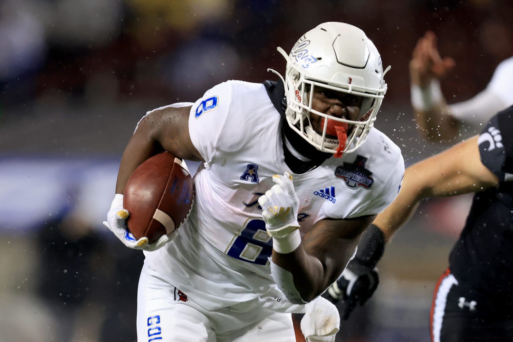 CINCINNATI, OHIO - DECEMBER 19: Deneric Prince #8 of the Tulsa Golden Hurricane runs the ball in the game against the Cincinnati Bearcats in the American Athletic Conference Championship at Nippert Stadium on December 19, 2020 in Cincinnati, Ohio. (Photo by Justin Casterline/Getty Images)