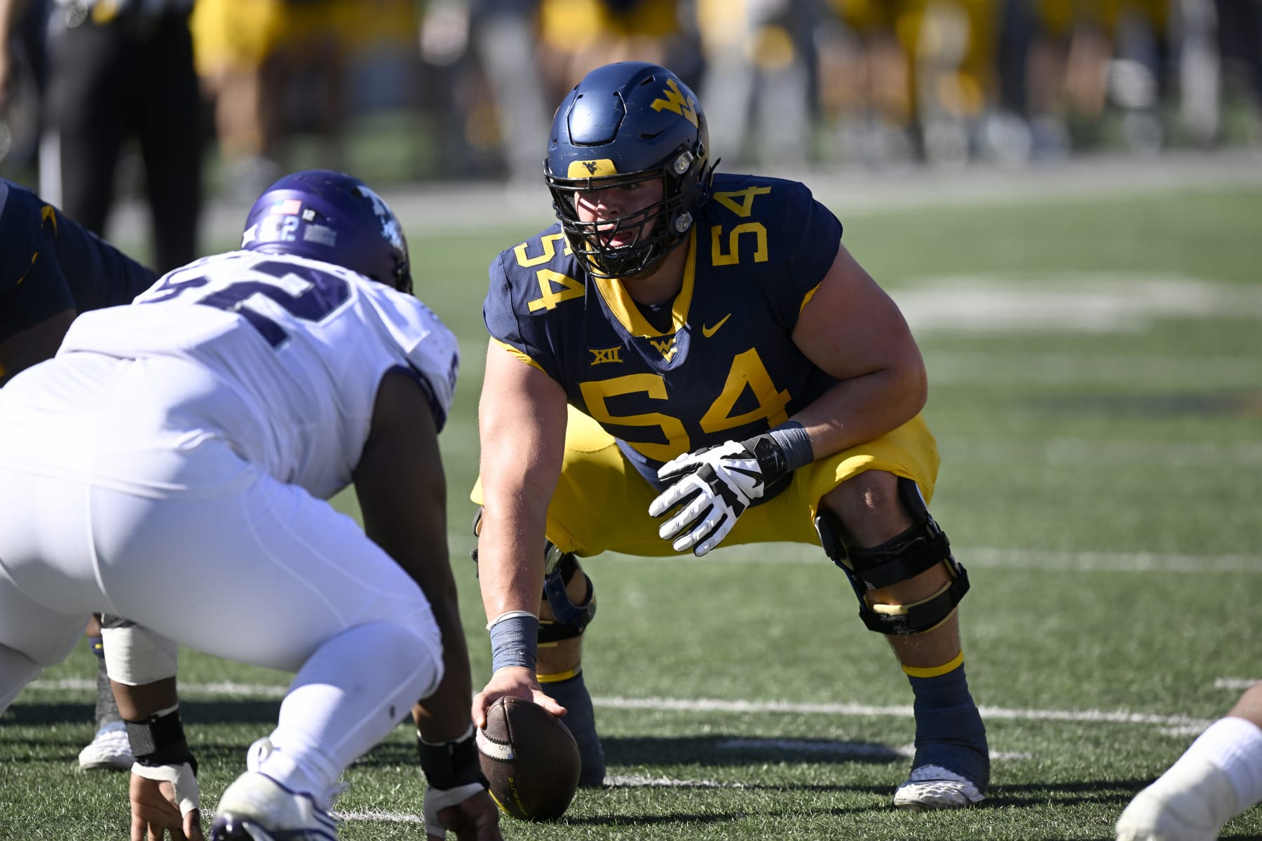 MORGANTOWN, WEST VIRGINIA - OCTOBER 29: Zach Frazier #54 of the West Virginia Mountaineers lines up against the TCU Horned Frogs at Mountaineer Field on October 29, 2022 in Morgantown, West Virginia. (Photo by G Fiume/Getty Images)