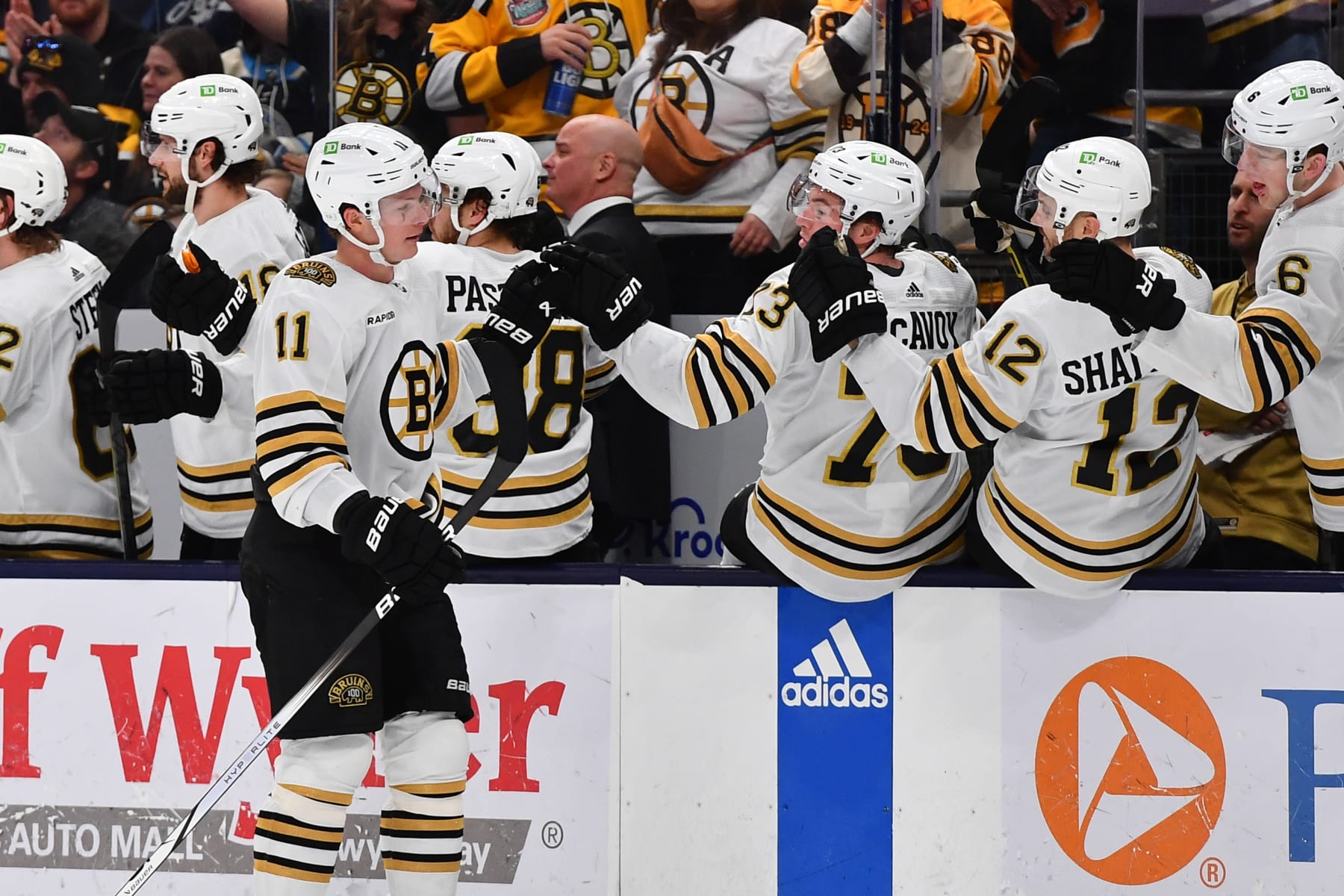 COLUMBUS, OHIO - JANUARY 2: Trent Frederic #11 of the Boston Bruins high-fives his teammates after scoring a goal during the third period of a game against the Columbus Blue Jackets at Nationwide Arena on January 2, 2024 in Columbus, Ohio. (Photo by Ben Jackson/NHLI via Getty Images)