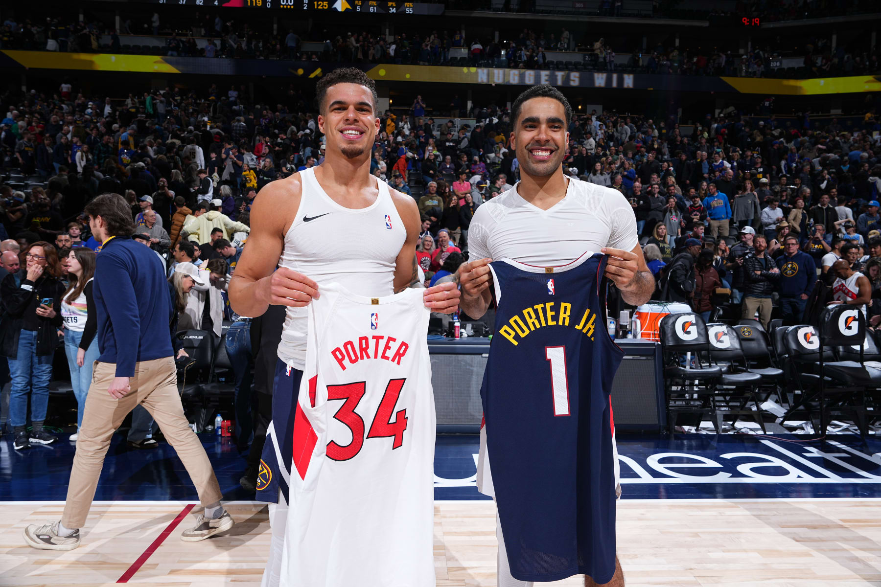 DENVER, CO - MARCH 11: Michael Porter Jr. #1 of the Denver Nuggets and Jontay Porter #34 of the Toronto Raptor swap jerseys after the game on March 11, 2024 at the Ball Arena in Denver, Colorado. NOTE TO USER: User expressly acknowledges and agrees that, by downloading and/or using this Photograph, user is consenting to the terms and conditions of the Getty Images License Agreement. Mandatory Copyright Notice: Copyright 2024 NBAE (Photo by Garrett Ellwood/NBAE via Getty Images)