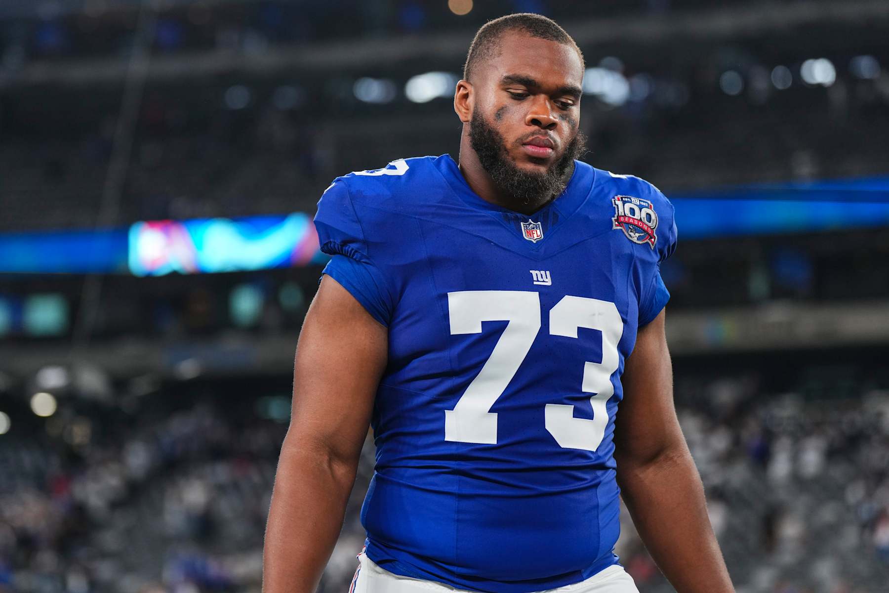 EAST RUTHERFORD, NJ - SEPTEMBER 26: Evan Neal #73 of the New York Giants walks off of the field after an NFL football game against the Dallas Cowboys at MetLife Stadium on September 26, 2024 in East Rutherford, New Jersey. (Photo by Cooper Neill/Getty Images)