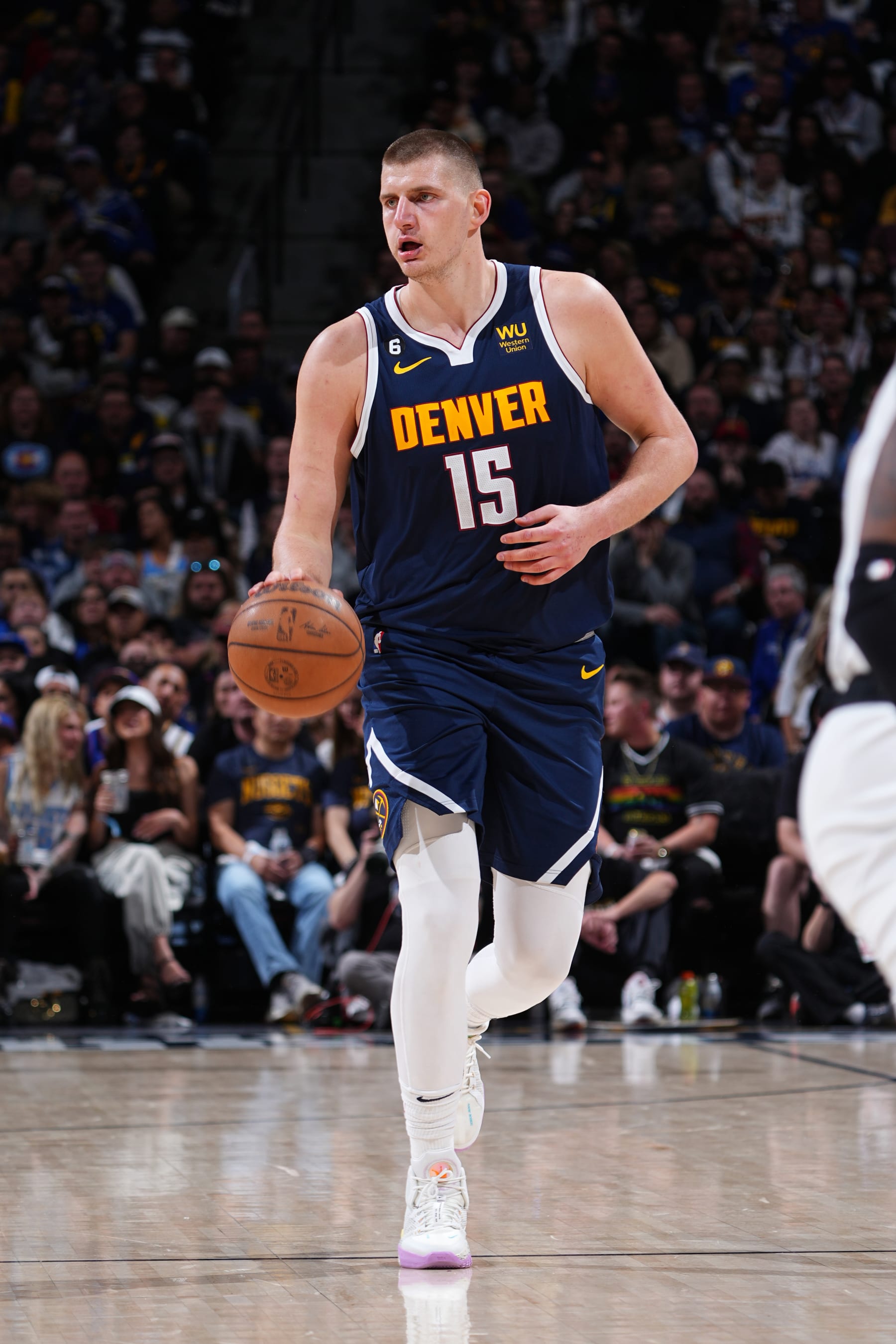 DENVER, CO - APRIL 19: Nikola Jokic #15 of the Denver Nuggets dribbles the ball during Round 1 Game 2 of the 2023 NBA Playoffs against the Minnesota Timberwolves on April 19, 2023 at the Ball Arena in Denver, Colorado. NOTE TO USER: User expressly acknowledges and agrees that, by downloading and/or using this Photograph, user is consenting to the terms and conditions of the Getty Images License Agreement. Mandatory Copyright Notice: Copyright 2023 NBAE (Photo by Garrett Ellwood/NBAE via Getty Images)