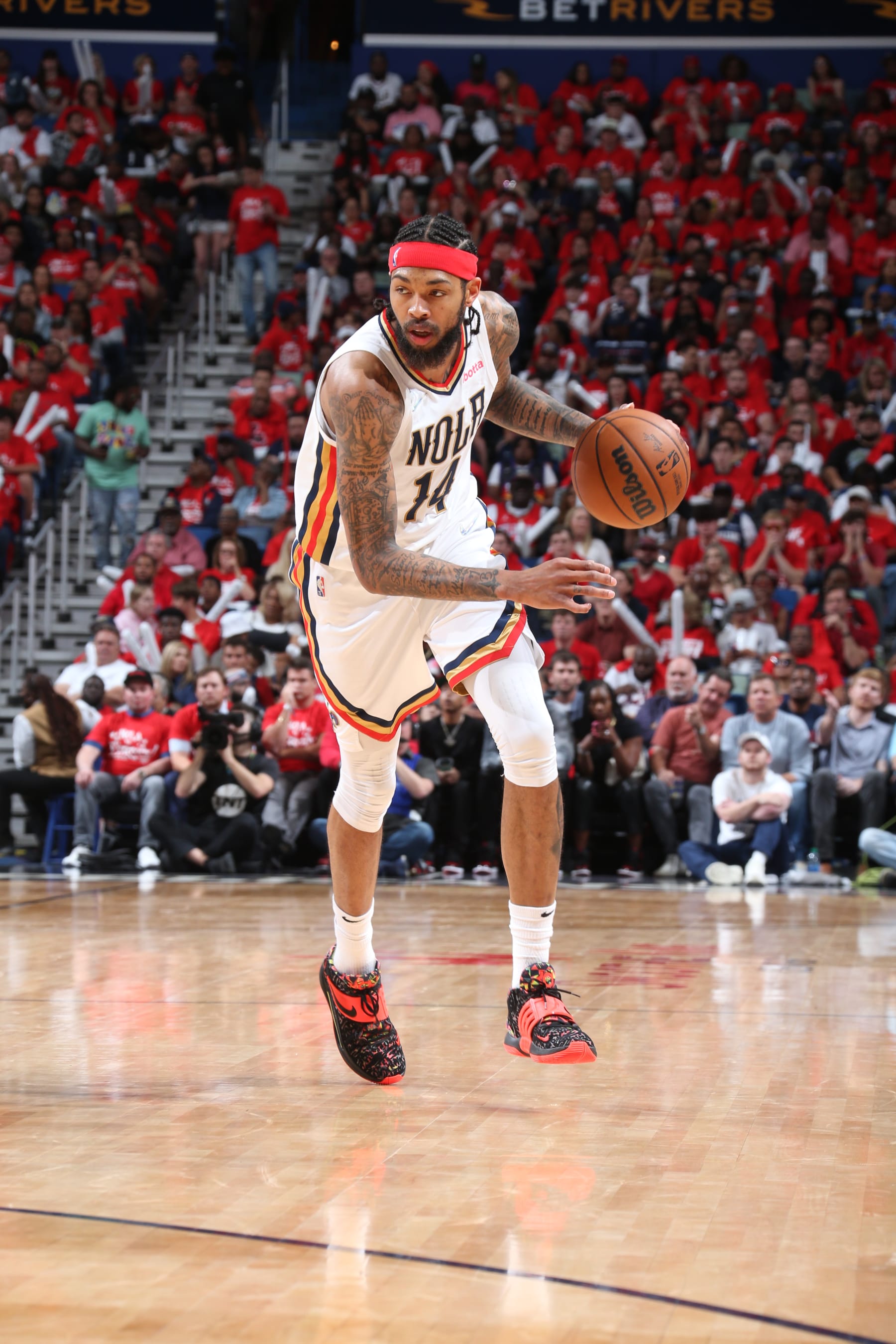 NEW ORLEANS, LA - APRIL 28: Brandon Ingram #14 of the New Orleans Pelicans dribbles the ball during Round 1 Game 6 of the 2022 NBA Playoffs against the Phoenix Suns on April 28, 2022 at the Smoothie King Center in New Orleans, Louisiana. NOTE TO USER: User expressly acknowledges and agrees that, by downloading and or using this Photograph, user is consenting to the terms and conditions of the Getty Images License Agreement. Mandatory Copyright Notice: Copyright 2022 NBAE (Photo by Layne Murdoch Jr./NBAE via Getty Images)
