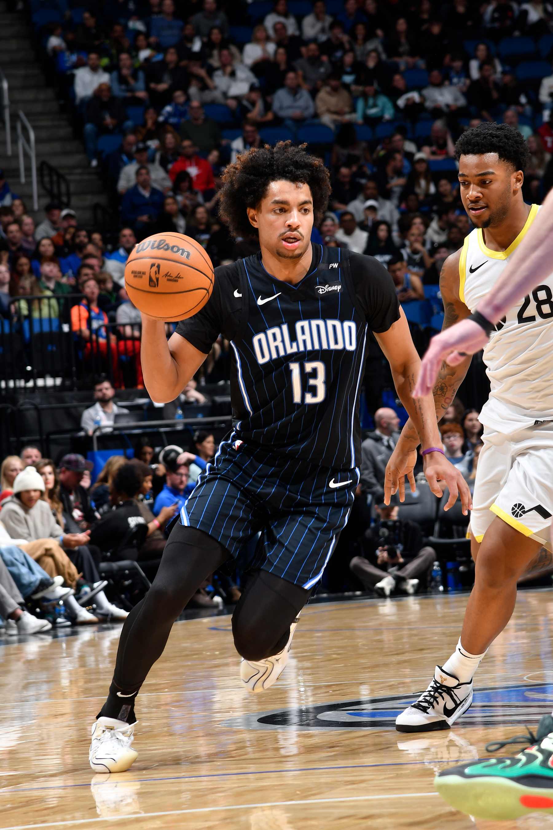 ORLANDO, FL - JANUARY 5 : Jett Howard #13 of the Orlando Magic dribbles the ball during the game against the Utah Jazz  on January 5, 2025 at Kia Center in Orlando, Florida. NOTE TO USER: User expressly acknowledges and agrees that, by downloading and or using this photograph, User is consenting to the terms and conditions of the Getty Images License Agreement. Mandatory Copyright Notice: Copyright 2025 NBAE (Photo by Fernando Medina/NBAE via Getty Images)