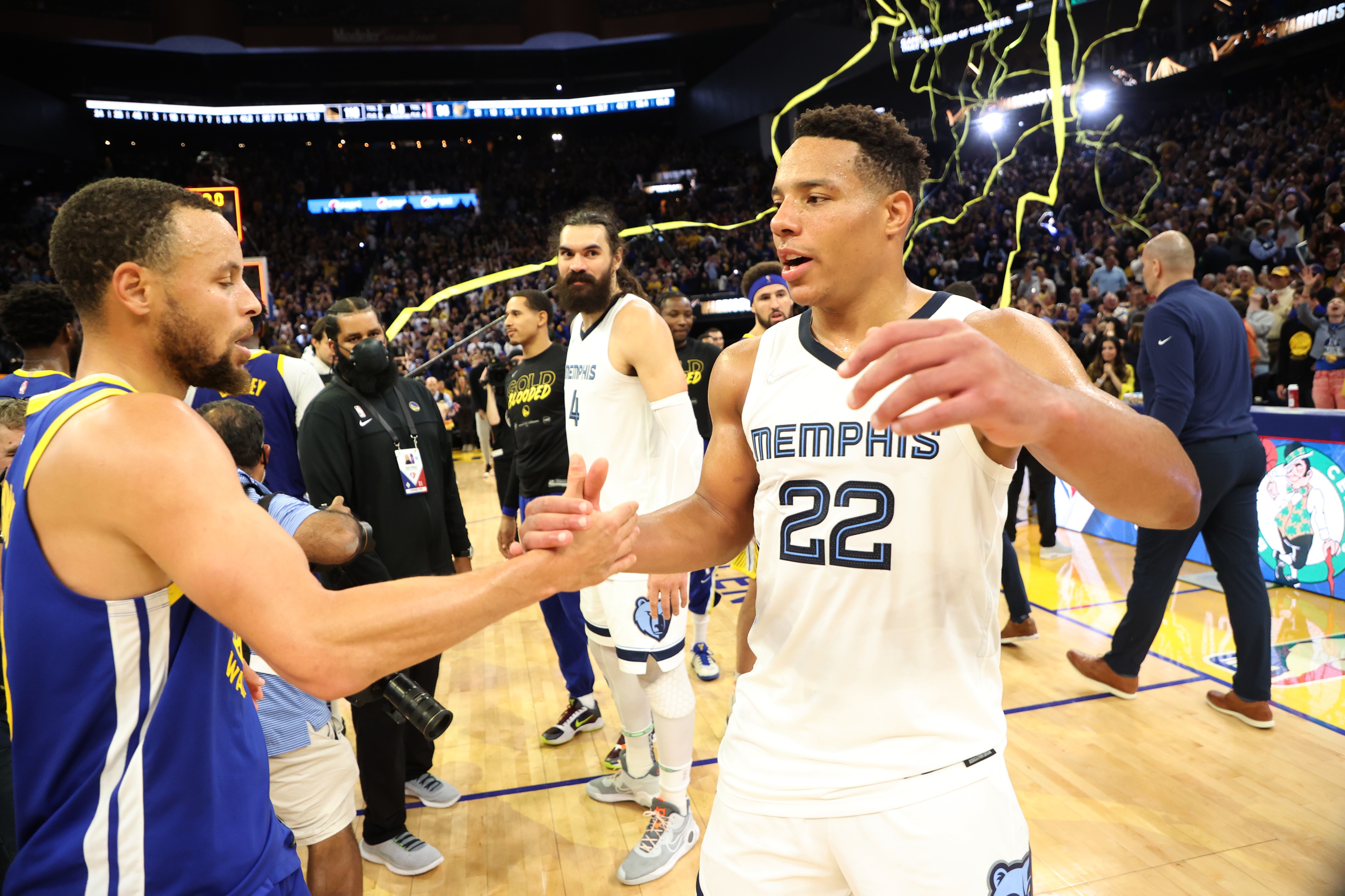 San Francisco, CA - MAY 13: Stephen Curry #30 of the Golden State Warriors high fives Desmond Bane #22 of the Memphis Grizzlies after Game 6 of the 2022 NBA Playoffs Western Conference Semifinals on May 13, 2021 at Chase Center in San Francisco, California. NOTE TO USER: User expressly acknowledges and agrees that, by downloading and or using this photograph, User is consenting to the terms and conditions of the Getty Images License Agreement. Mandatory Copyright Notice: Copyright 2021 NBAE (Photo by Joe Murphy/NBAE via Getty Images)