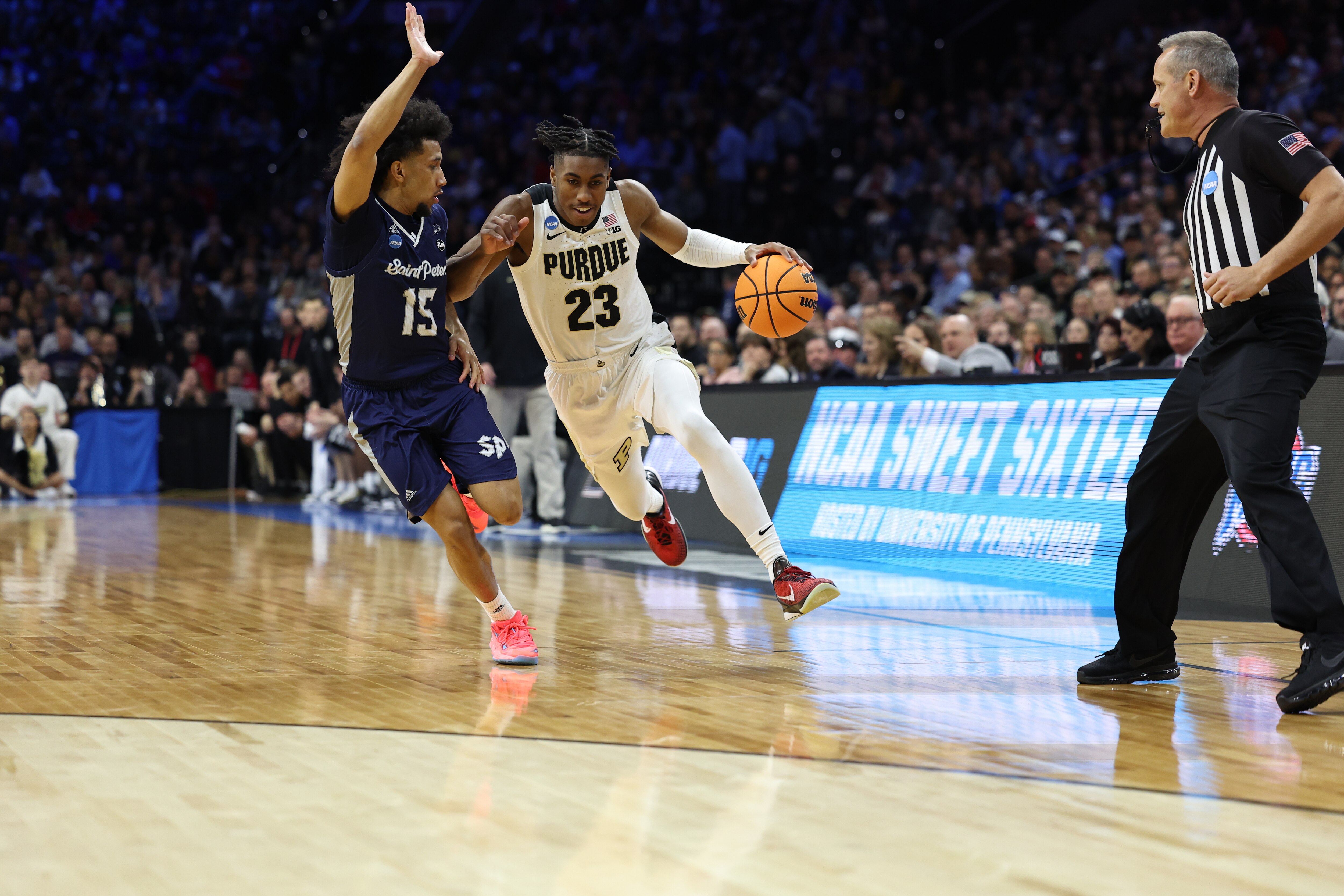 PHILADELPHIA, PA - MARCH 25: Jaden Ivey #23 of the Purdue Boilermakers dribbles the ball to the basket against Matthew Lee #15 of the St. Peter's Peacocks during the Sweet 16 round of the 2022 NCAA Mens Basketball Tournament held at Wells Fargo Center on March 25, 2022 in Philadelphia, Pennsylvania. (Photo by Scott Taetsch/NCAA Photos via Getty Images)