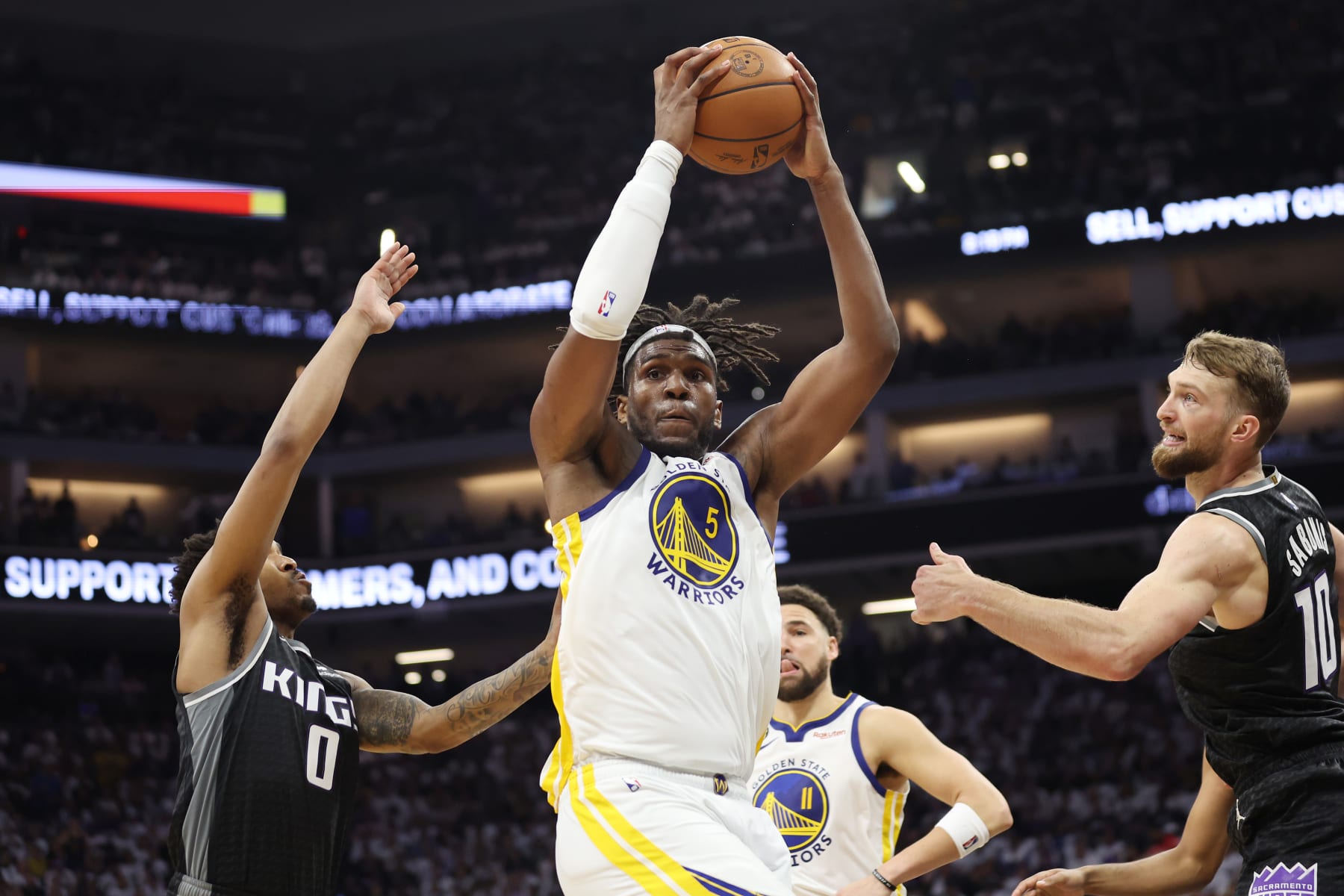 SACRAMENTO, CALIFORNIA - APRIL 30: Kevon Looney #5 of the Golden State Warriors handles the ball during the third quarter in game seven of the Western Conference First Round Playoffs against the Sacramento Kings at Golden 1 Center on April 30, 2023 in Sacramento, California. NOTE TO USER: User expressly acknowledges and agrees that, by downloading and or using this photograph, User is consenting to the terms and conditions of the Getty Images License Agreement. (Photo by Ezra Shaw/Getty Images)