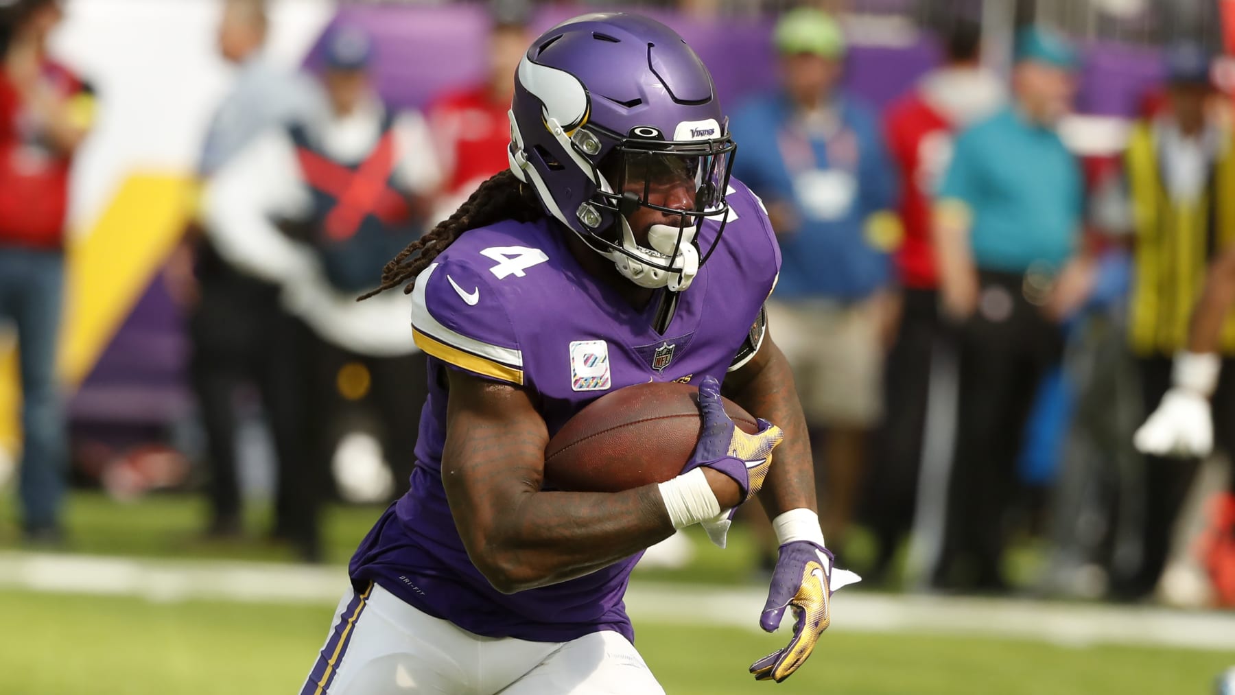 Minnesota Vikings running back Dalvin Cook (4) carries the ball up field during the first half of an NFL football game against the Chicago Bears, Sunday, Oct. 9, 2022, in Minneapolis. (AP Photo/Bruce Kluckhohn) Minnesota Vikings running back Dalvin Cook (4) carries the ball up field during the first half of an NFL football game against the Chicago Bears, Sunday, Oct. 9, 2022, in Minneapolis. (AP Photo/Bruce Kluckhohn)
