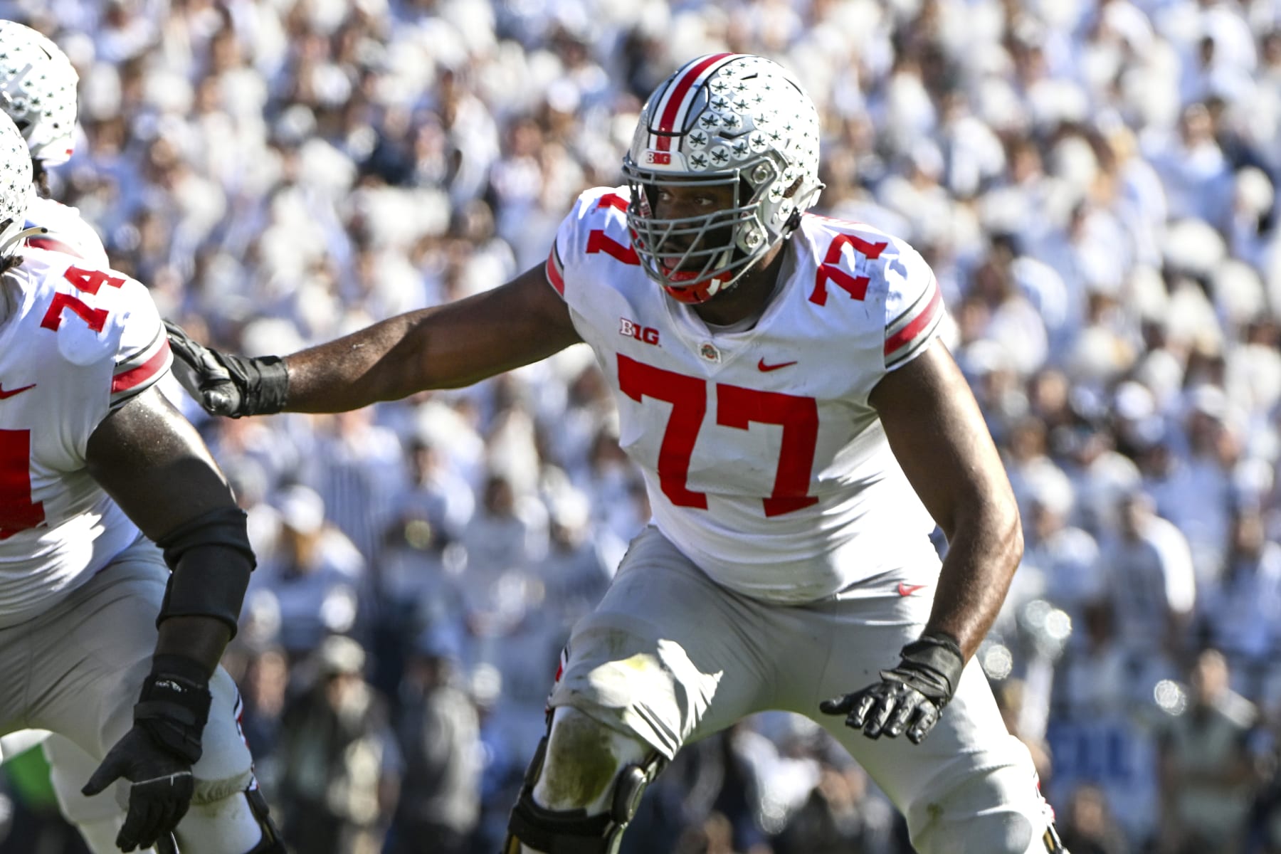 Ohio State offensive lineman Paris Johnson Jr. (77) looks for someone to block against Penn State during an NCAA college football game, Saturday, Oct. 29, 2022, in State College, Pa. (AP Photo/Barry Reeger)
