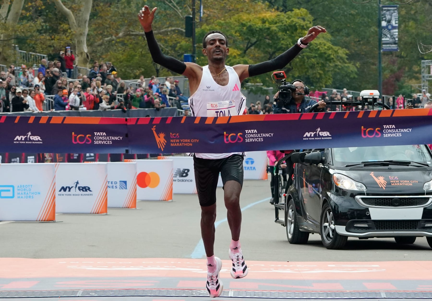 Ethiopia's Tamirat Tola celebrates winning the 52nd Edition of the New York City Marathon on November 5, 2023. (Photo by TIMOTHY A. CLARY / AFP) / ALTERNATE CROP (Photo by TIMOTHY A. CLARY/AFP via Getty Images)
