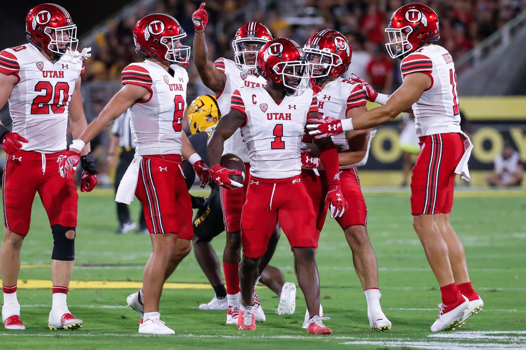 TEMPE, AZ - SEPTEMBER 24:  Utah Utes cornerback Clark Phillips III (1) celebrates with teammates after intercepting a pass during the college football game between the Utah Utes and the Arizona State Sun Devils on September 24, 2022 at Sun Devil Stadium in Tempe, Arizona. (Photo by Kevin Abele/Icon Sportswire via Getty Images)