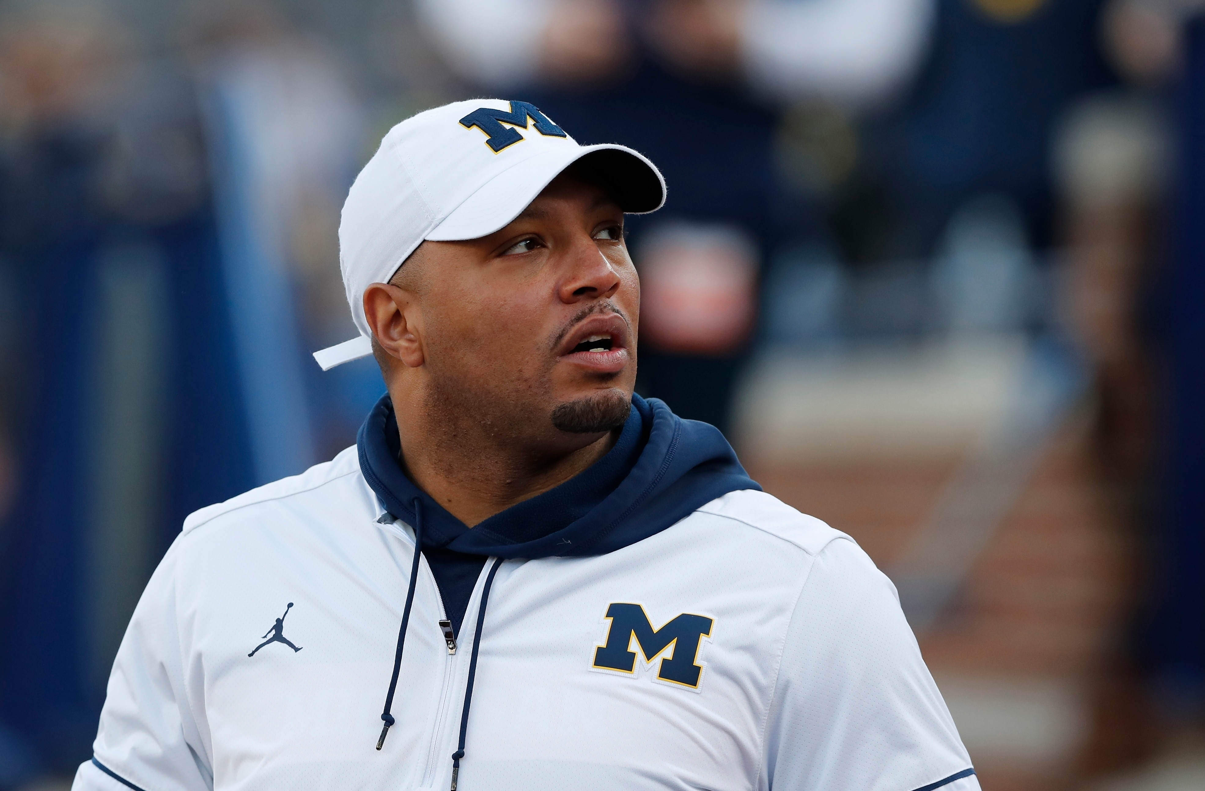 FILE - In this Saturday, April 13, 2019 file photo, Michigan offensive coordinator Josh Gattis during the team's annual spring NCAA college football game in Ann Arbor, Mich. Gattis is perhaps the most intriguing new offensive coordinator in the country as Jim Harbaugh seems to be ceding control in favor of a more modern approach. It’s not as if the Wolverines weren’t running spread elements and run-pass options last season with quarterback Shea Patterson. But bringing in Gattis suggests a more immersive approach.(AP Photo/Carlos Osorio, File)