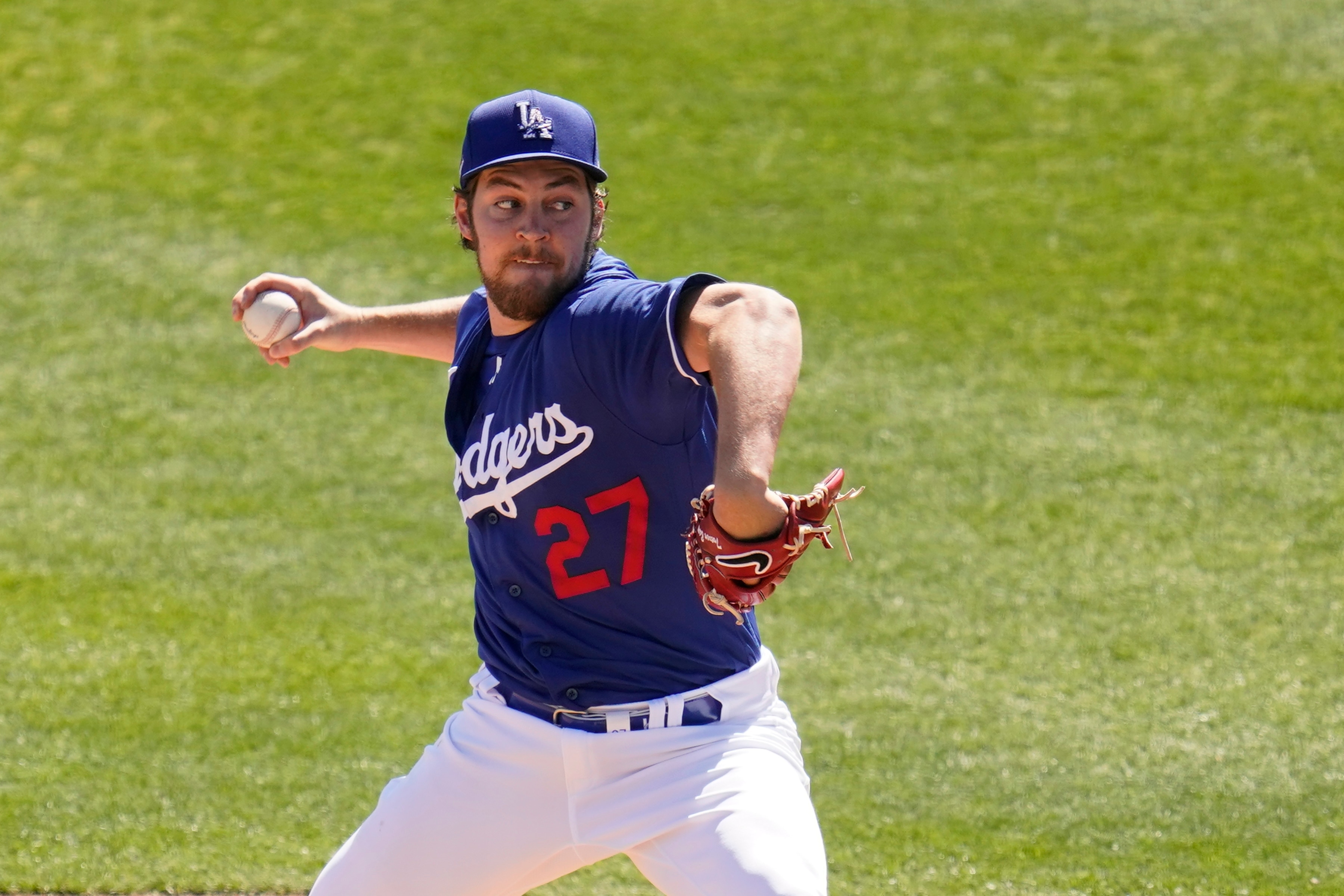 Los Angeles Dodgers starting pitcher Trevor Bauer throws a pitch against the San Diego Padres during the second inning of a spring training baseball game Saturday, March 6, 2021, in Phoenix. (AP Photo/Ross D. Franklin)
