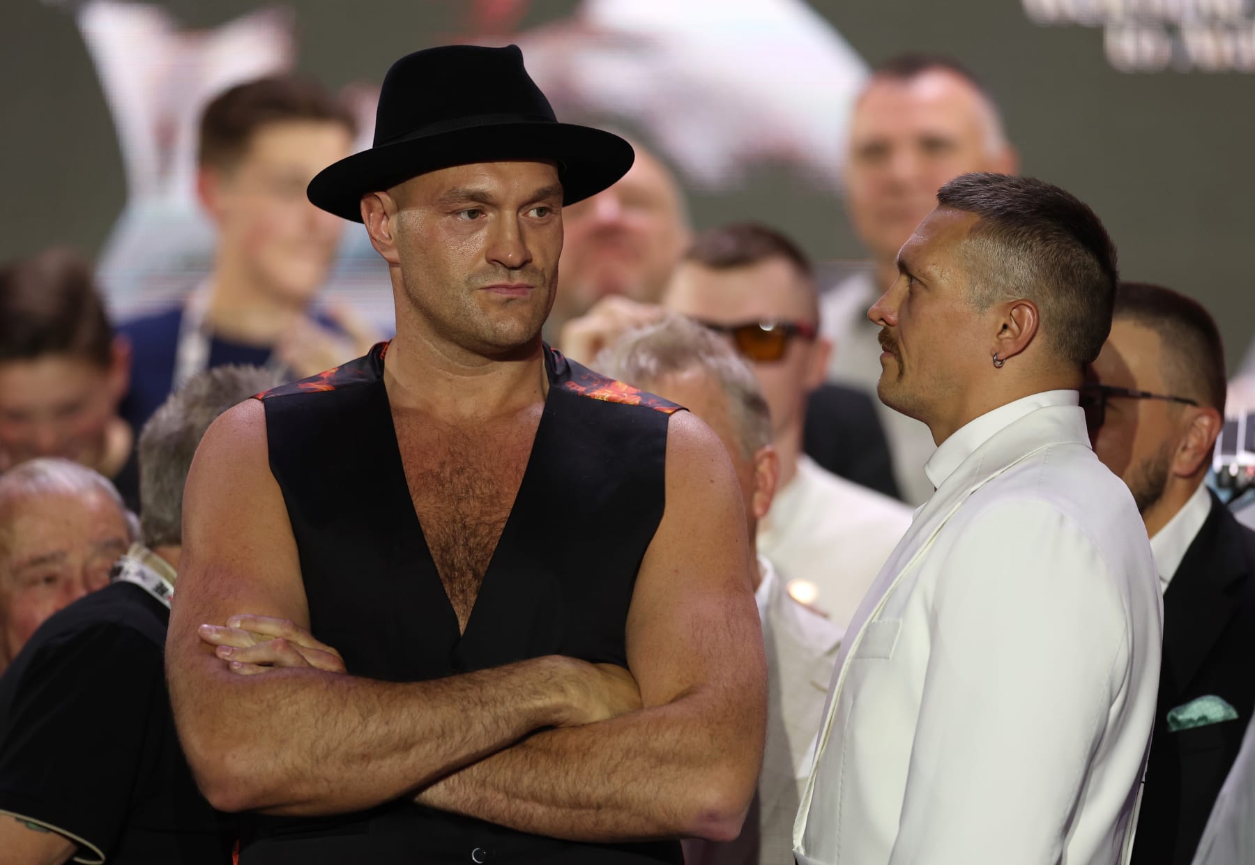 RIYADH, SAUDI ARABIA - MAY 16: Tyson Fury reacts alongside Oleksandr Usyk ahead of the IBF, IBO, WBA, WBC and WBO Undisputed World Heavyweight Title fight between Tyson Fury and Oleksandr Usyk  at BLVD City - Music World on May 16, 2024 in Riyadh, Saudi Arabia. (Photo by Richard Pelham/Getty Images)
