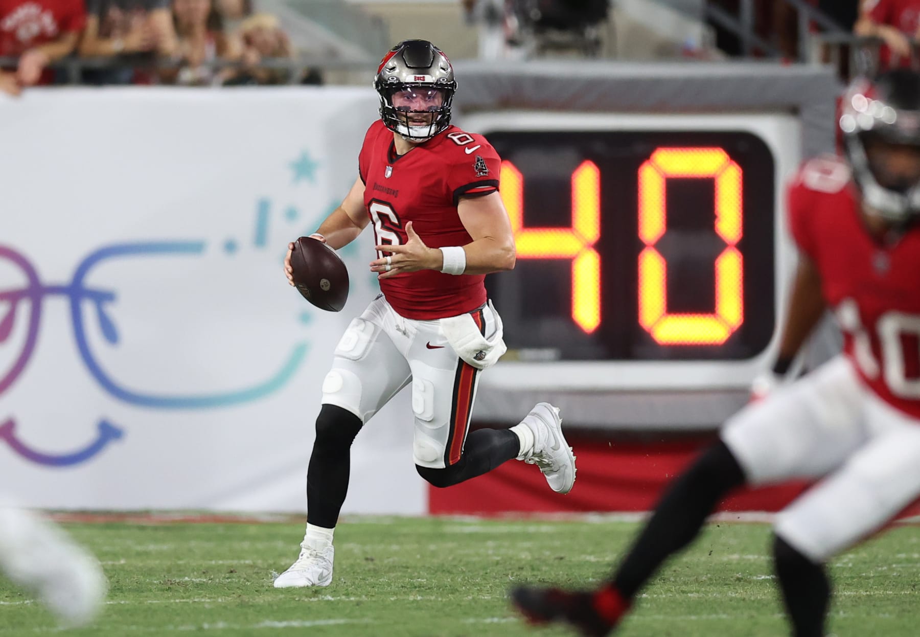 TAMPA, FLORIDA - SEPTEMBER 25: Baker Mayfield #6 of the Tampa Bay Buccaneers scrambles during the first quarter against the Philadelphia Eagles at Raymond James Stadium on September 25, 2023 in Tampa, Florida. (Photo by Mike Carlson/Getty Images)