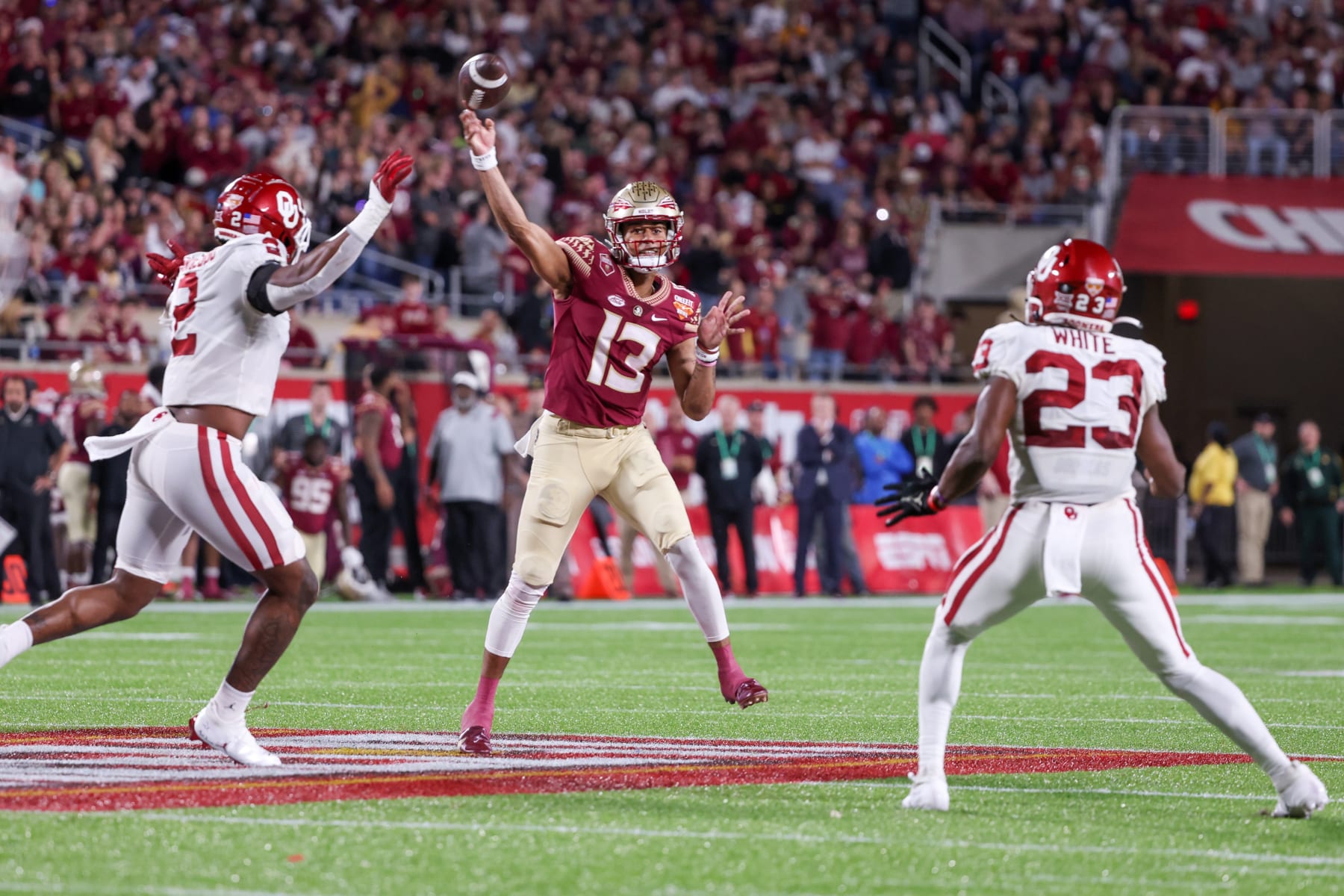 ORLANDO, FL - DECEMBER 29: Florida State Seminoles quarterback Jordan Travis (13) passes the ball during the Cheez-It Bowl between Oklahoma and Florida State on December 29, 2022 at Camping World Stadium, in Orlando FL. (Photo by Joe Petro/Icon Sportswire via Getty Images)