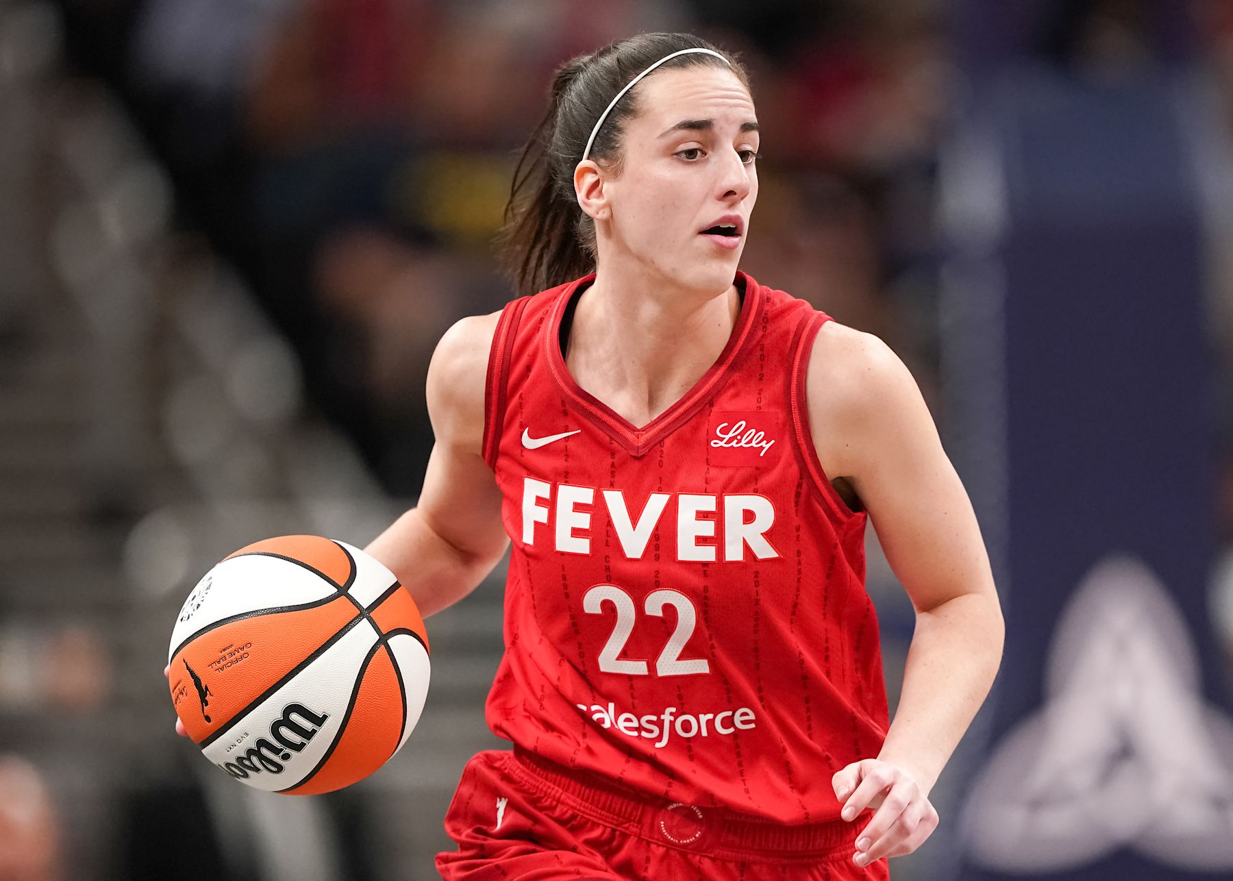 INDIANAPOLIS, INDIANA - SEPTEMBER 11: Caitlin Clark #22 of the Indiana Fever dribbles the ball in the first quarter against the Las Vegas Aces at Gainbridge Fieldhouse on September 11, 2024 in Indianapolis, Indiana. NOTE TO USER: User expressly acknowledges and agrees that, by downloading and or using this photograph, User is consenting to the terms and conditions of the Getty Images License Agreement. (Photo by Dylan Buell/Getty Images)