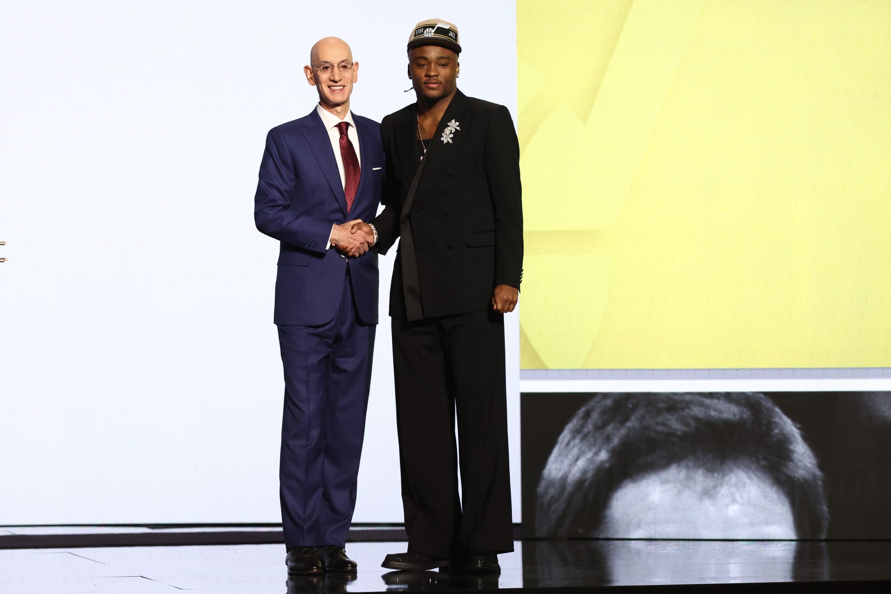 NEW YORK, NEW YORK - JUNE 26: Isaiah Collier (R) shakes hands with NBA commissioner Adam Silver (L) after being drafted 29th overall by the Utah Jazz during the first round of the 2024 NBA Draft at Barclays Center on June 26, 2024 in the Brooklyn borough of New York City. NOTE TO USER: User expressly acknowledges and agrees that, by downloading and or using this photograph, User is consenting to the terms and conditions of the Getty Images License Agreement. (Photo by Sarah Stier/Getty Images)